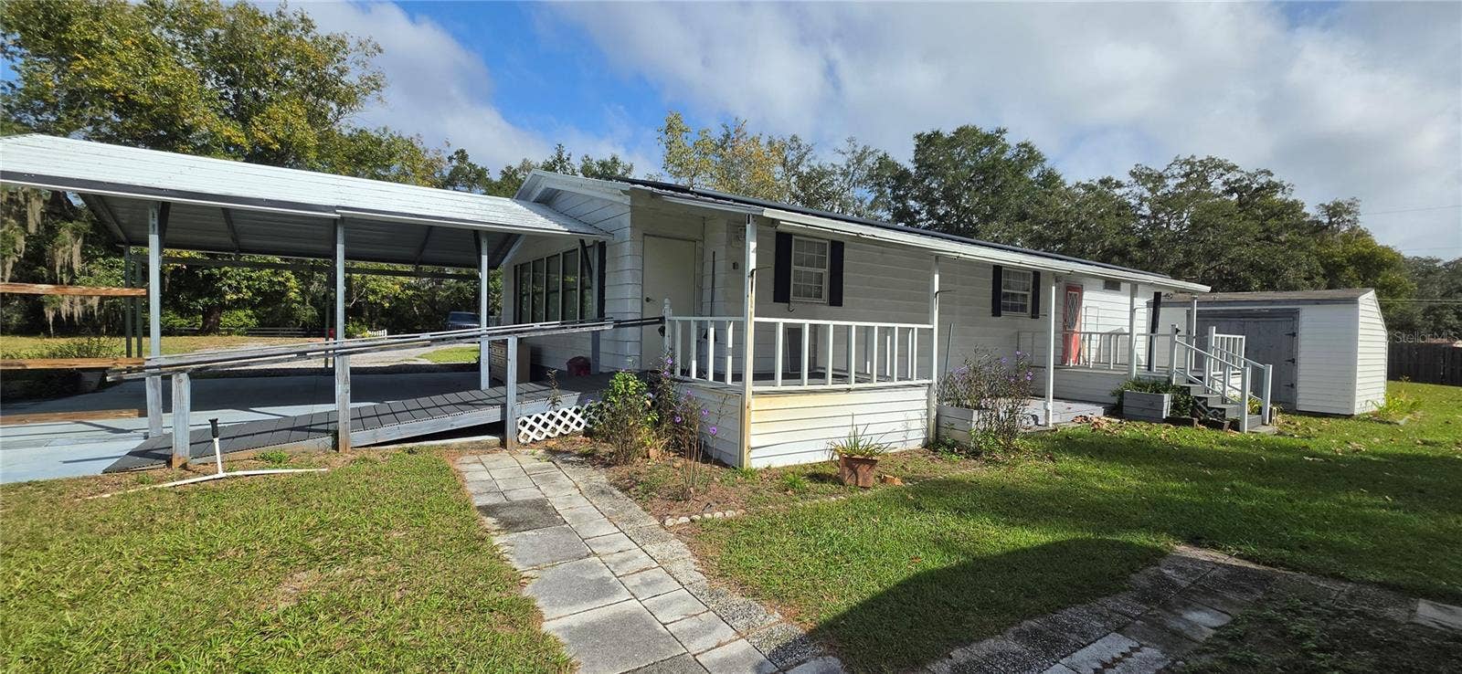 8090 E SUNRAY LANE, Floral City, FL 34436 Back of home and 2 porches
