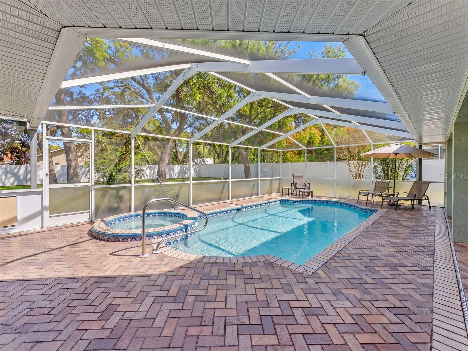 300 SILAS COURT, Spring Hill, FL 34609 Well maintained pool and deck area.
