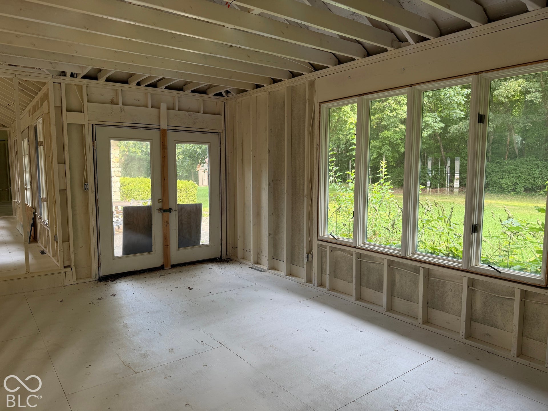 Large Window and French door overlooking picturesque back yard