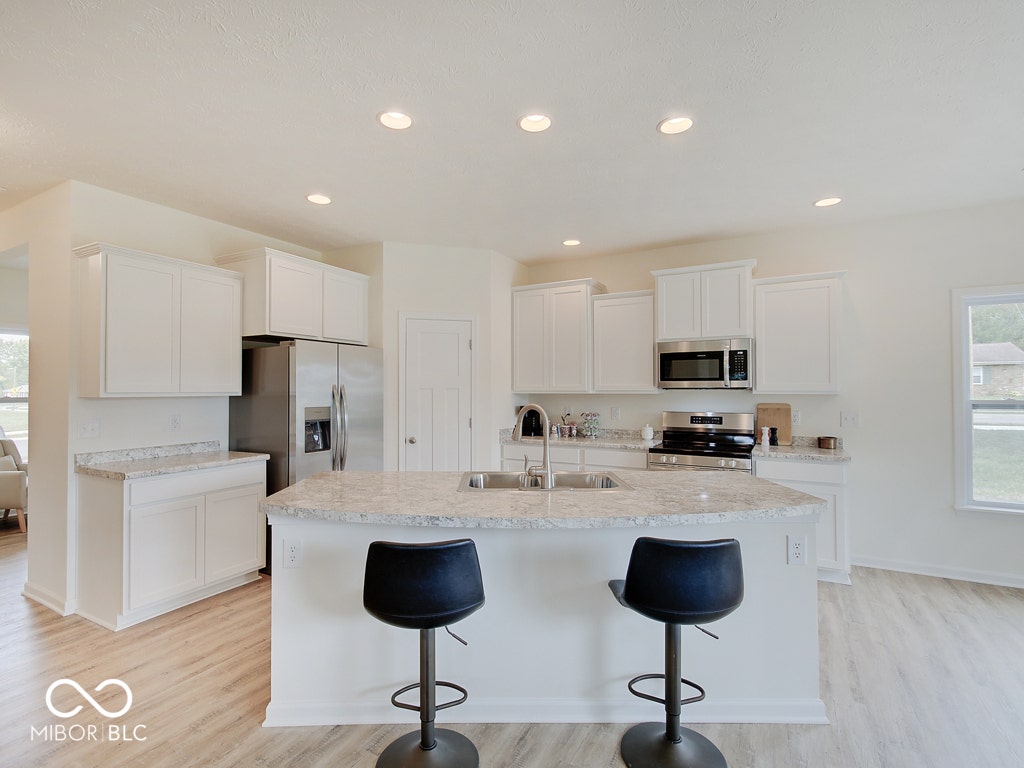 BEACON BUILDERS MODEL HOME IN WINDSTAR WOODS.