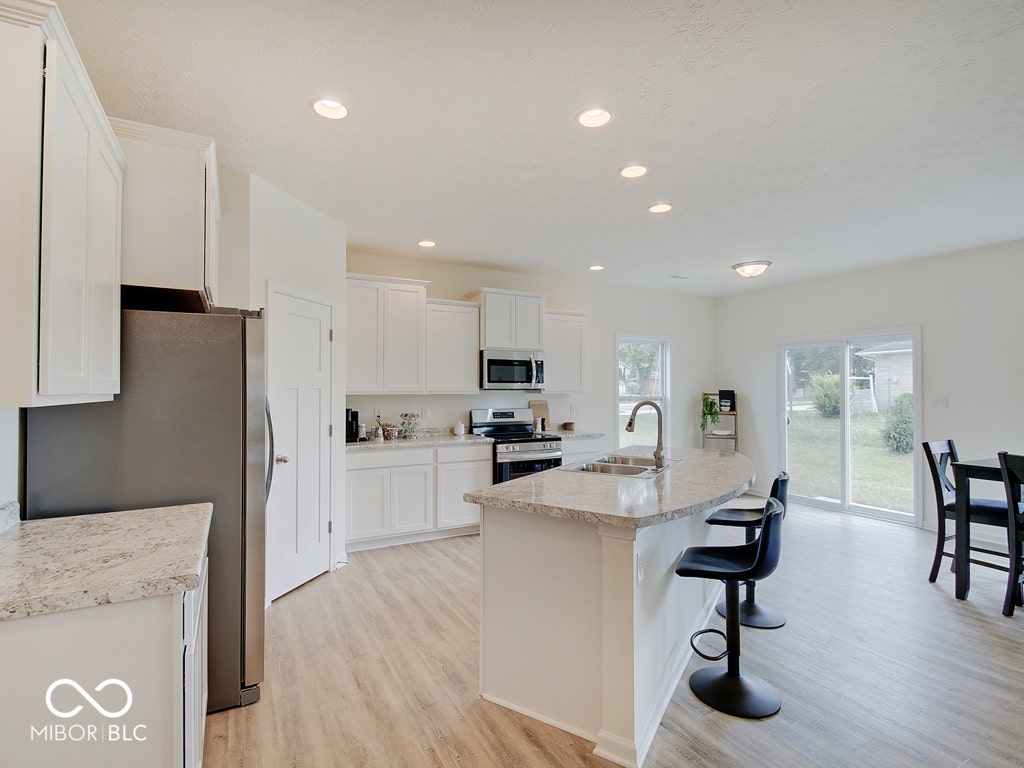 BEACON BUILDERS MODEL HOME IN WINDSTAR WOODS.