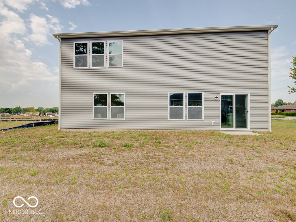 BEACON BUILDERS MODEL HOME IN WINDSTAR WOODS.