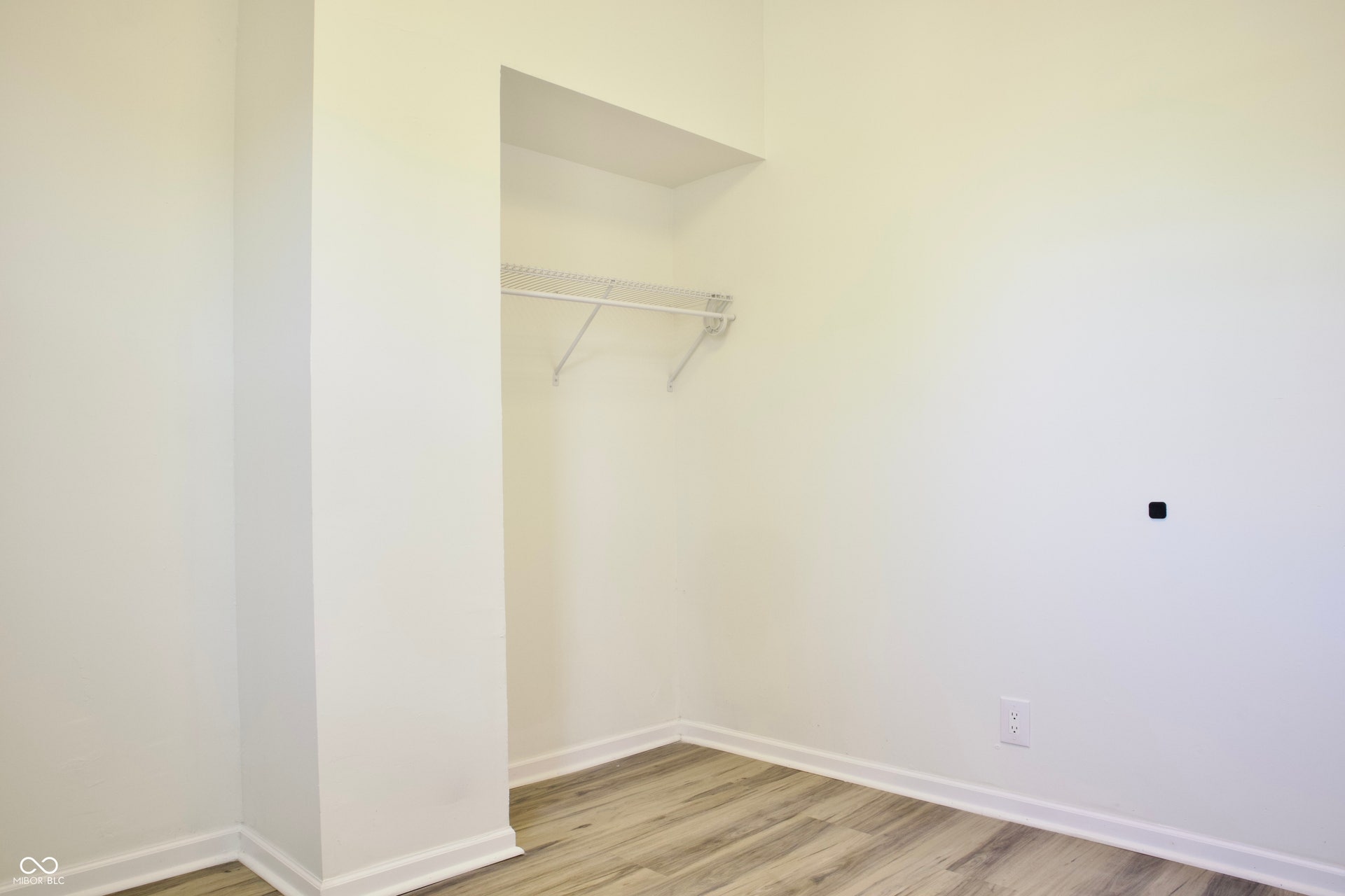 474 N Randolph Street, Indianapolis, IN 46201 Closet with a shelf and hanging rod to keep things organized.