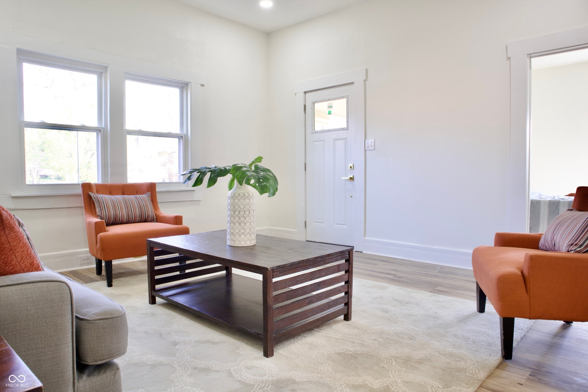 474 N Randolph Street, Indianapolis, IN 46201 Bright living room with big windows, recessed lighting, and easy-care vinyl plank floors.