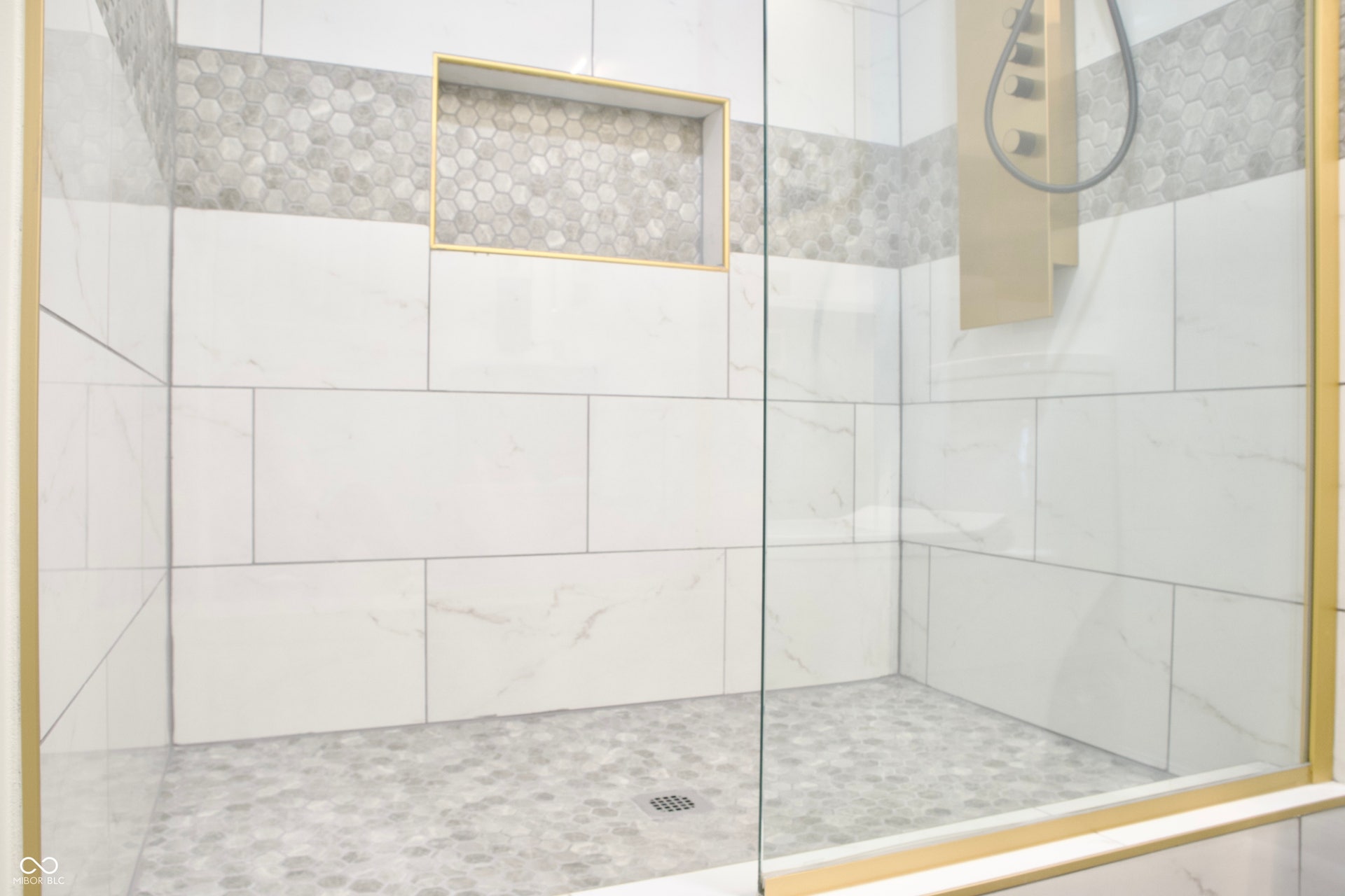 474 N Randolph Street, Indianapolis, IN 46201 Glass-enclosed walk-in shower with a mosaic tile floor.