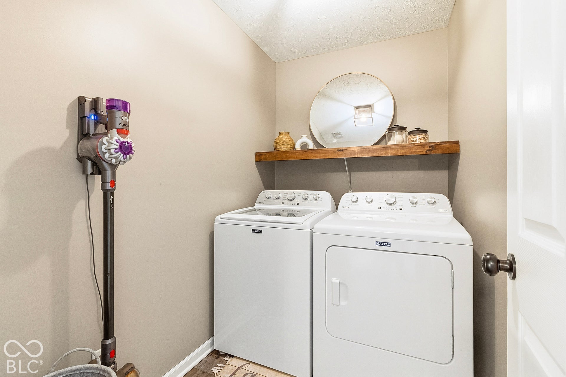 Upstairs Laundry Room: Conveniently located upstairs near the bedrooms, this dedicated laundry room makes everyday living effortless.