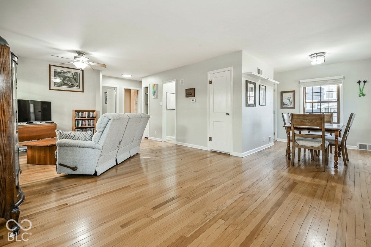 View of dining room and living room with beautiful hardwood floors.
