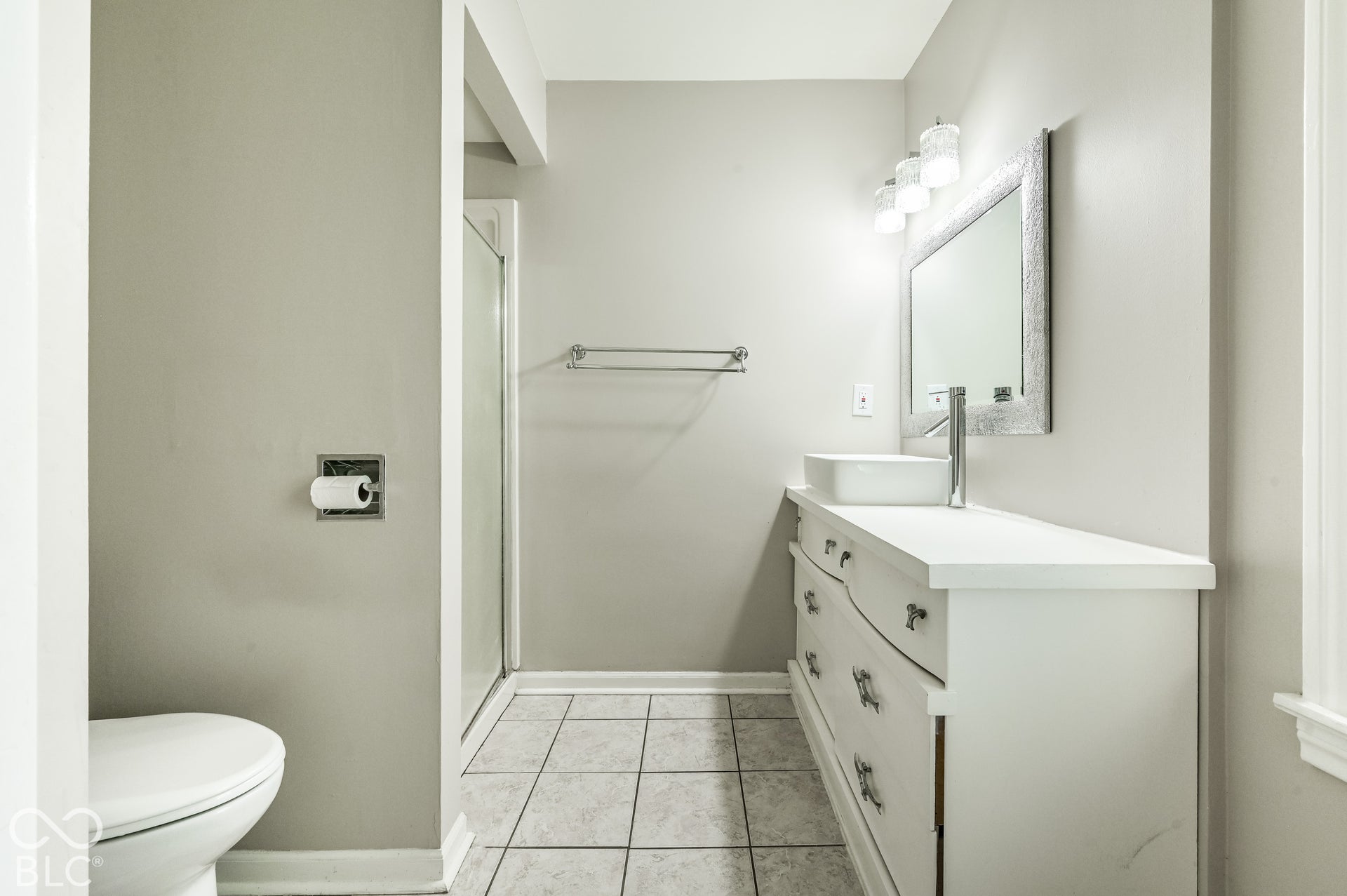 Full bath walk a walk-in shower and a tile floor.