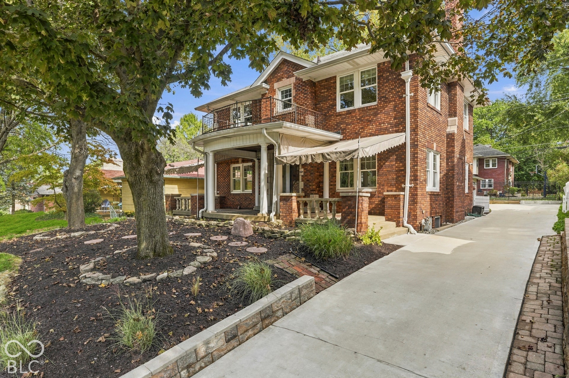 Front view showing the side of the home, too, as well as the recently installed driveway