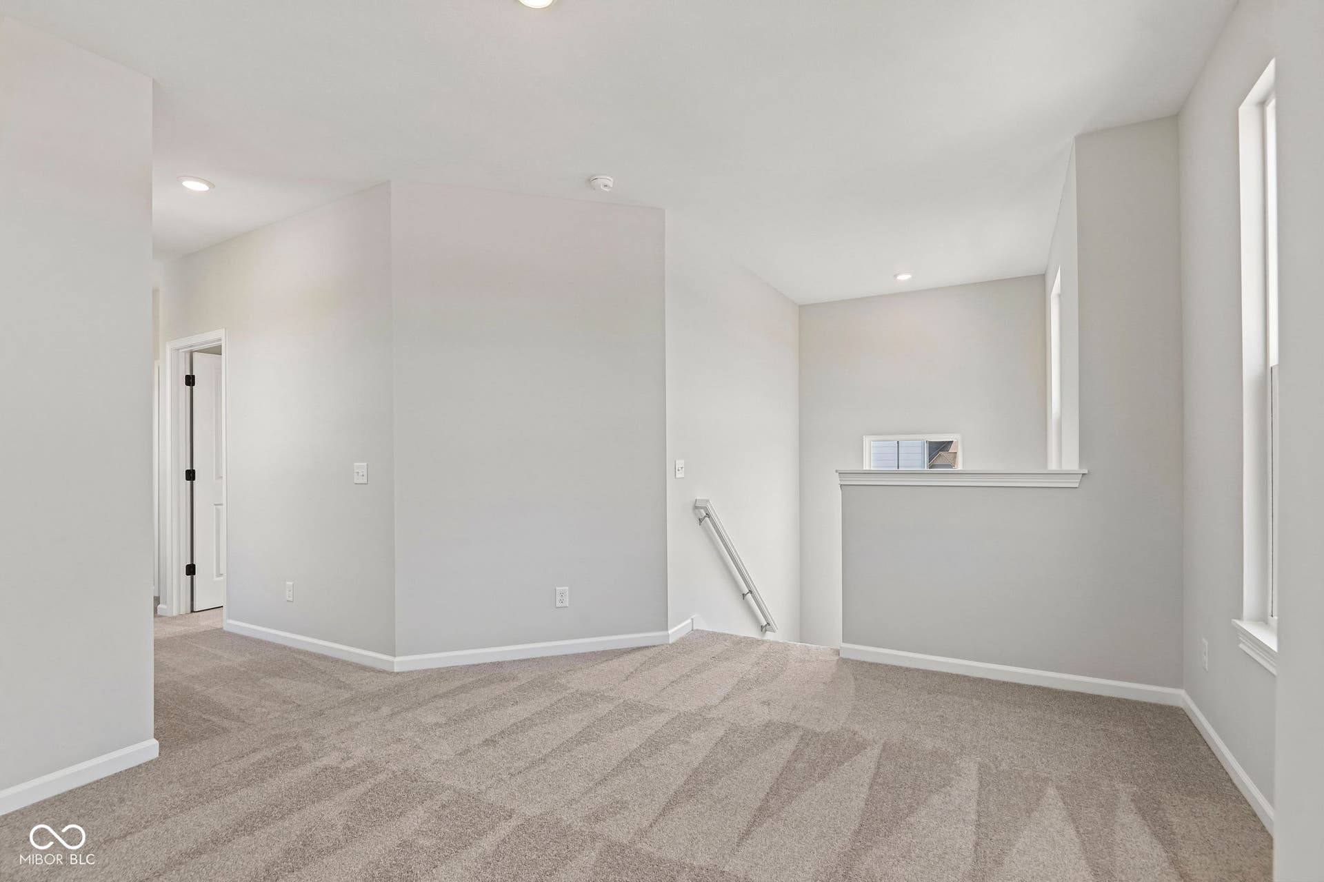 15691 Showdown Road, Noblesville, IN 46060 Carpeted upper-level landing featuring recessed lighting, white trim, and light gray walls