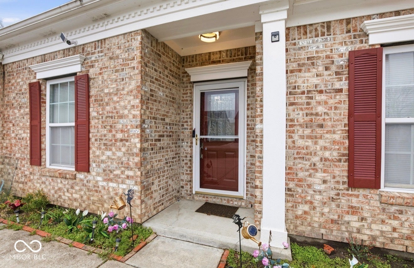 344 Legacy Boulevard, Greenwood, IN 46143 property entrance featuring brick siding