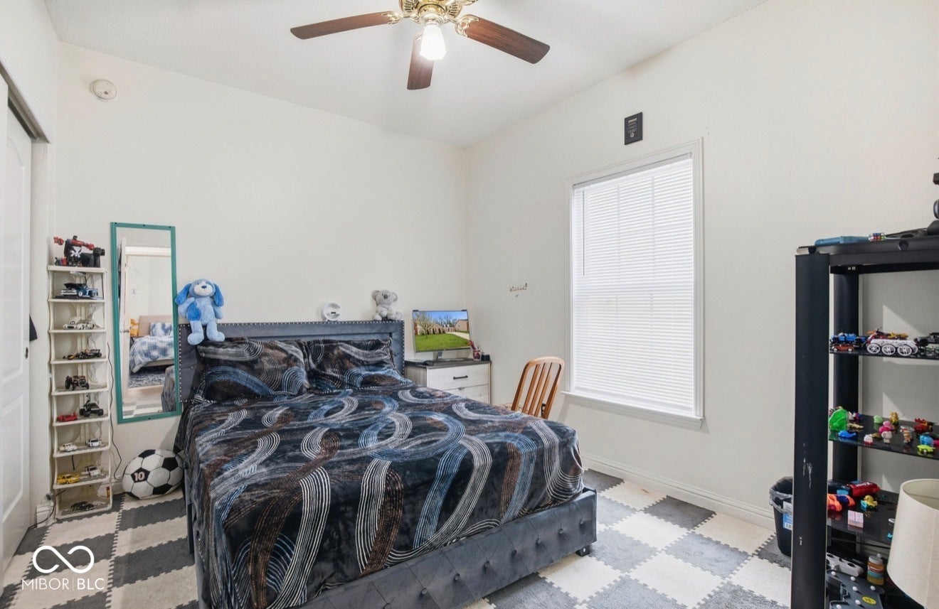 344 Legacy Boulevard, Greenwood, IN 46143 bedroom featuring a ceiling fan and baseboards