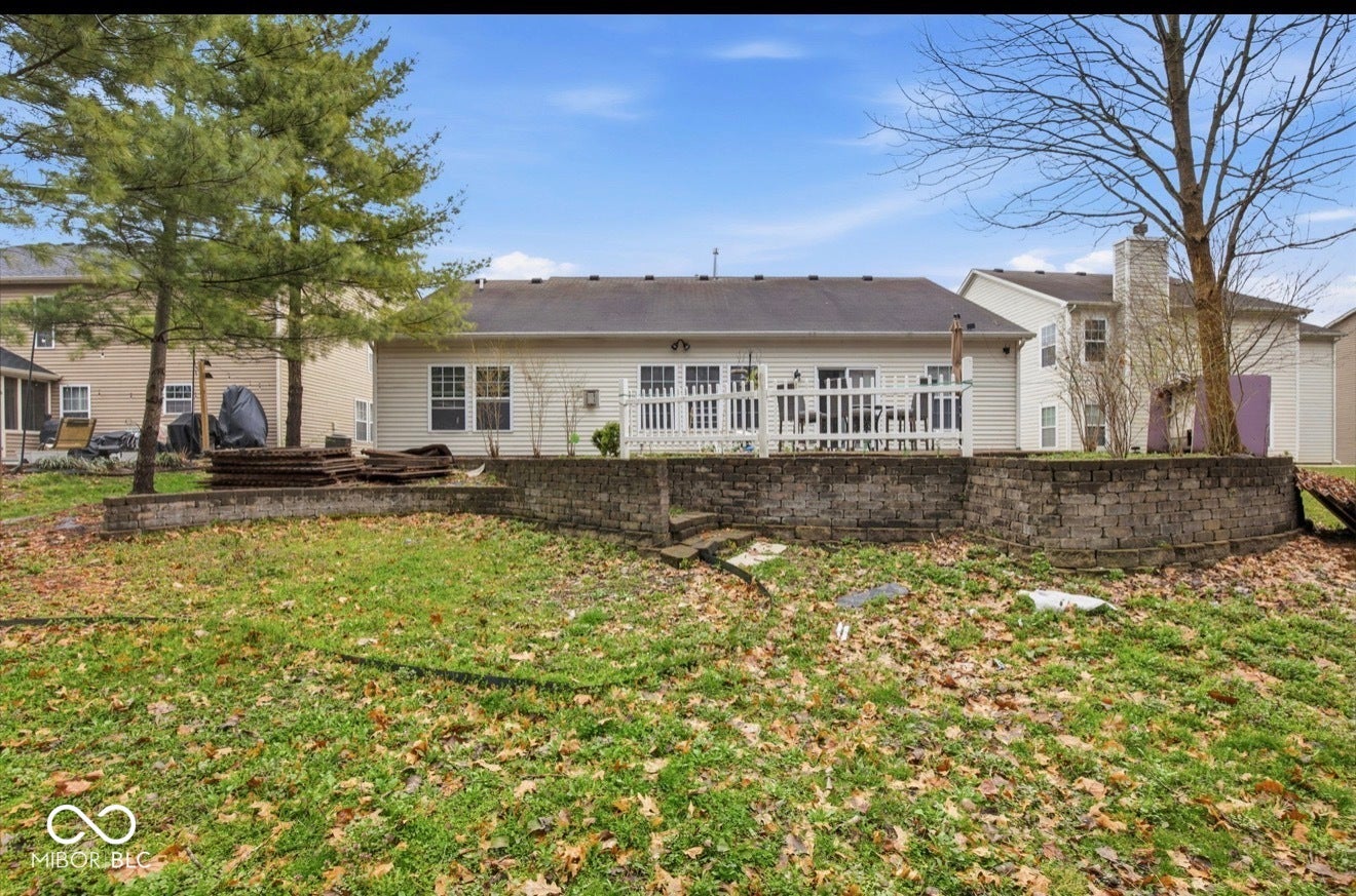 344 Legacy Boulevard, Greenwood, IN 46143 rear view of house with a yard