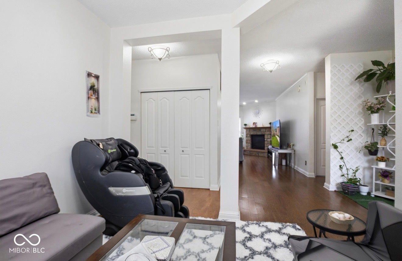344 Legacy Boulevard, Greenwood, IN 46143 living room featuring wood finished floors and a fireplace