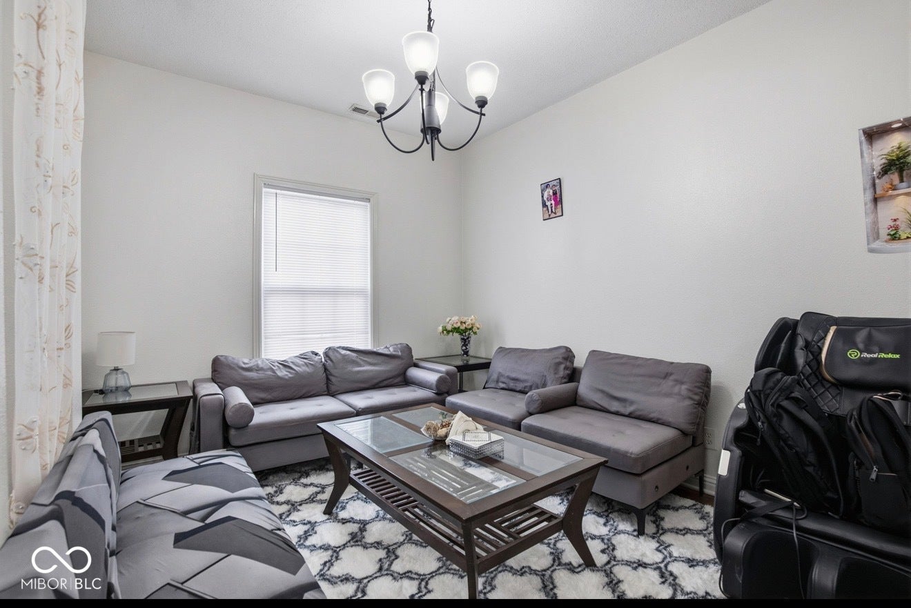 344 Legacy Boulevard, Greenwood, IN 46143 living room featuring suspended lighting