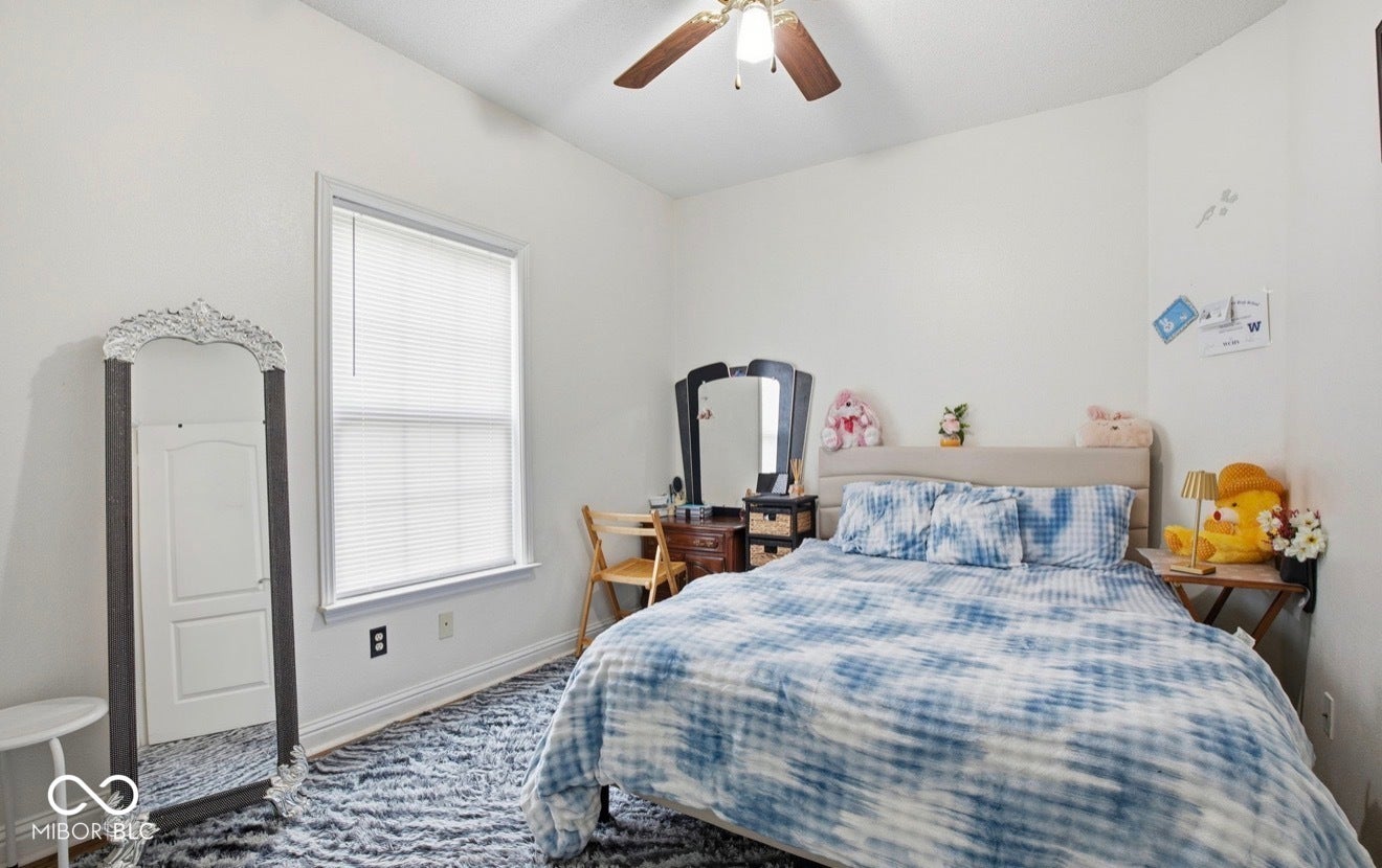 344 Legacy Boulevard, Greenwood, IN 46143 bedroom with baseboards and ceiling fan