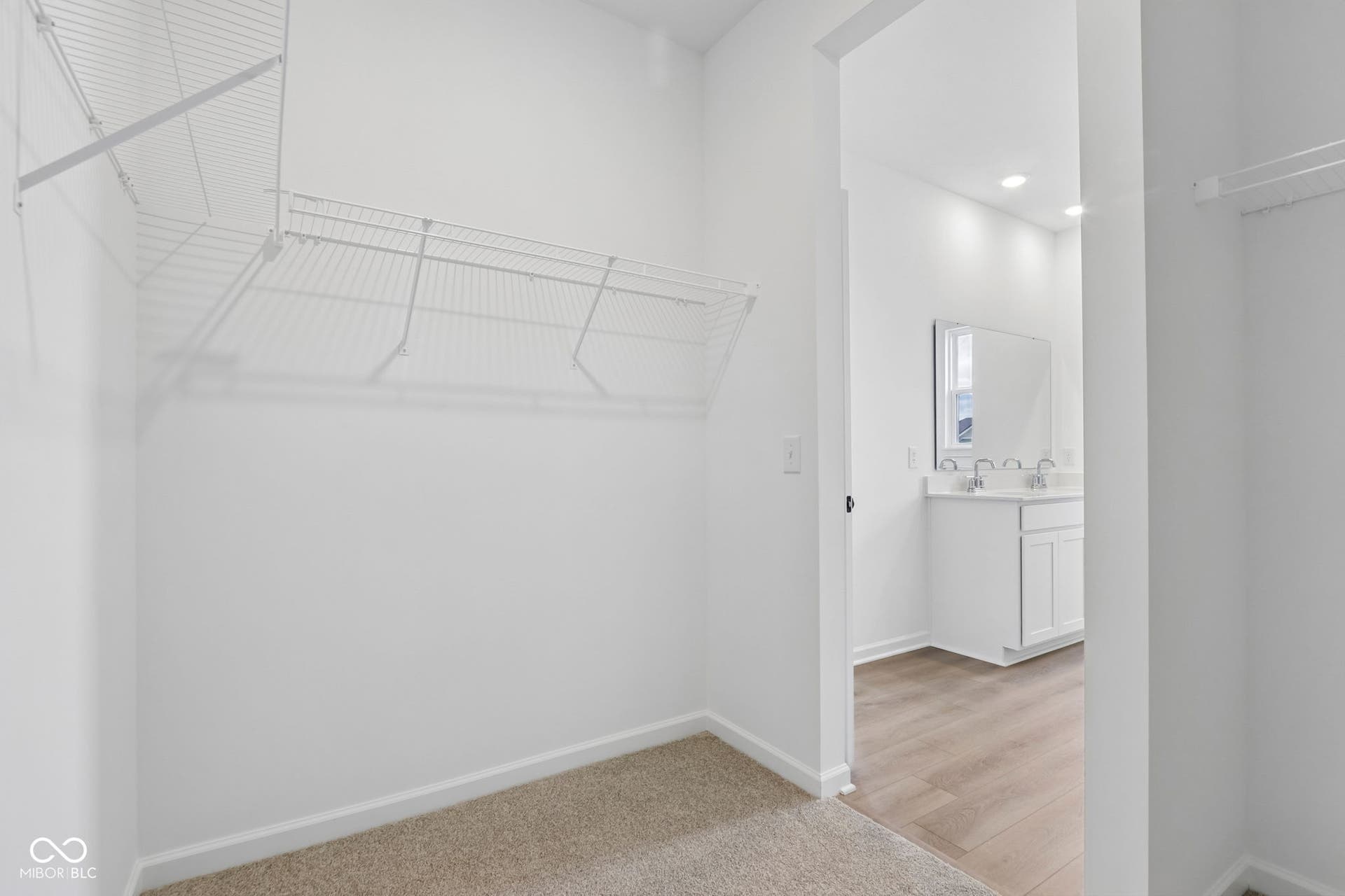 5748 Arcade Boulevard, McCordsville, IN 46055 Carpeted walk-in closet with wire shelving system