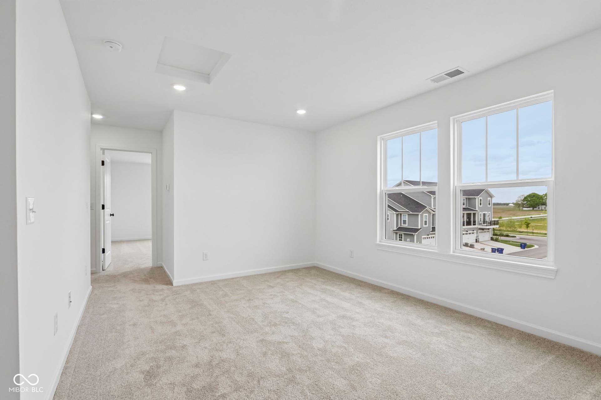 5748 Arcade Boulevard, McCordsville, IN 46055 Carpeted room with recessed lighting and two large windows