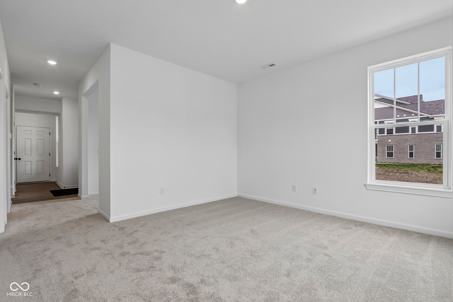 5748 Arcade Boulevard, McCordsville, IN 46055 Spacious room featuring neutral carpeting, recessed lighting, and a large window