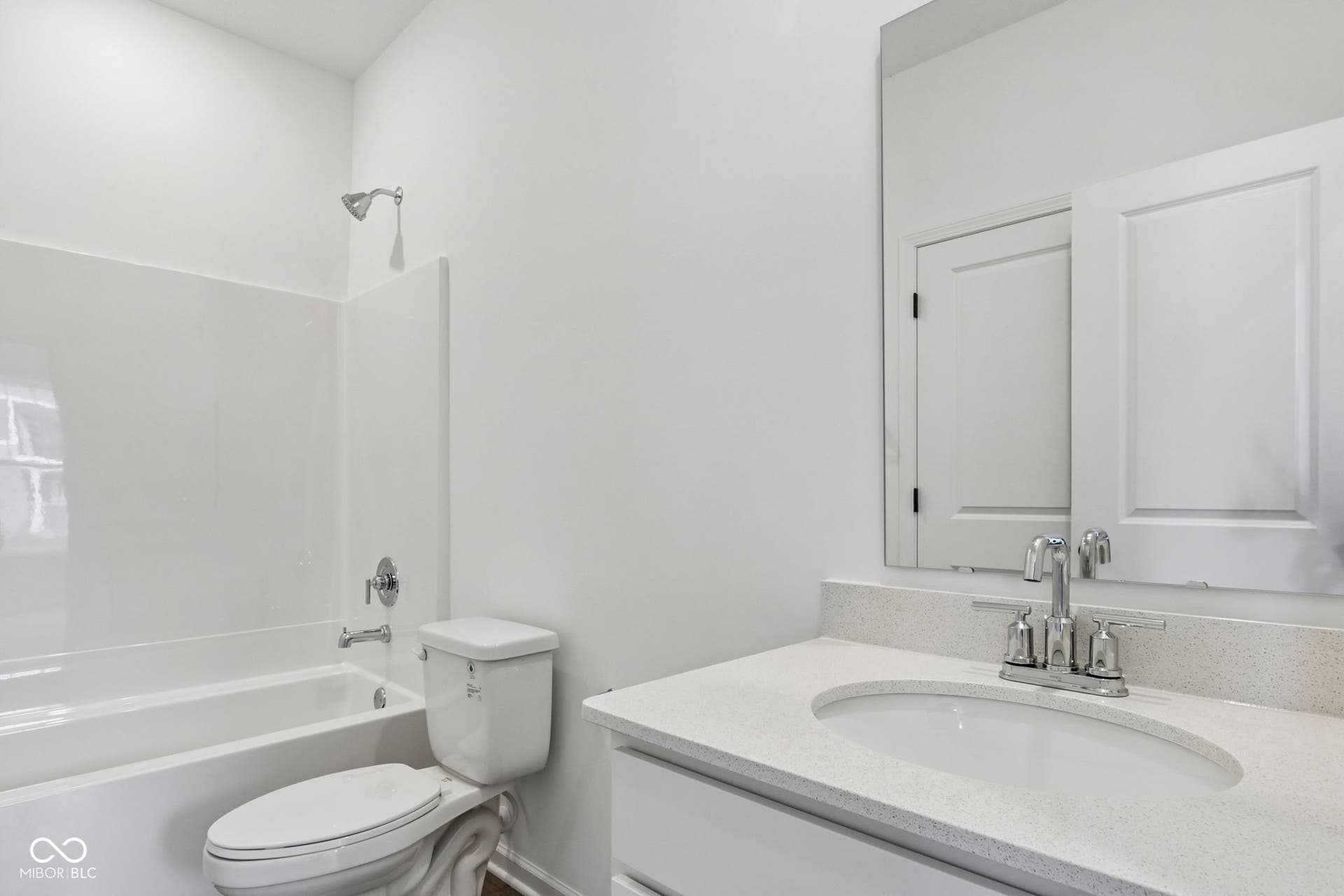 5748 Arcade Boulevard, McCordsville, IN 46055 Crisp, white bathroom featuring a shower-over-tub combination with a clean surround