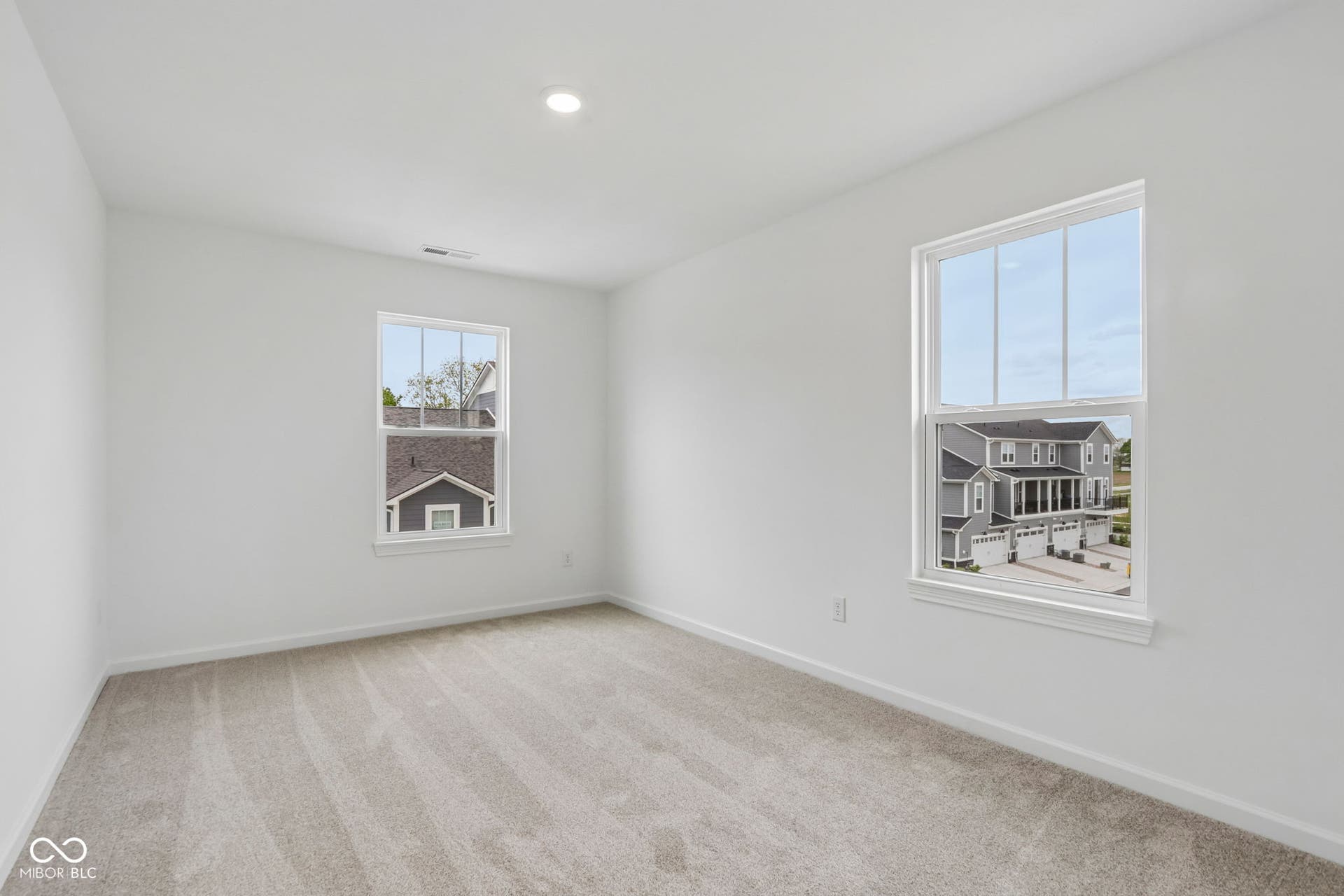 5748 Arcade Boulevard, McCordsville, IN 46055 Neutral-toned carpeting enhancing the bright white walls