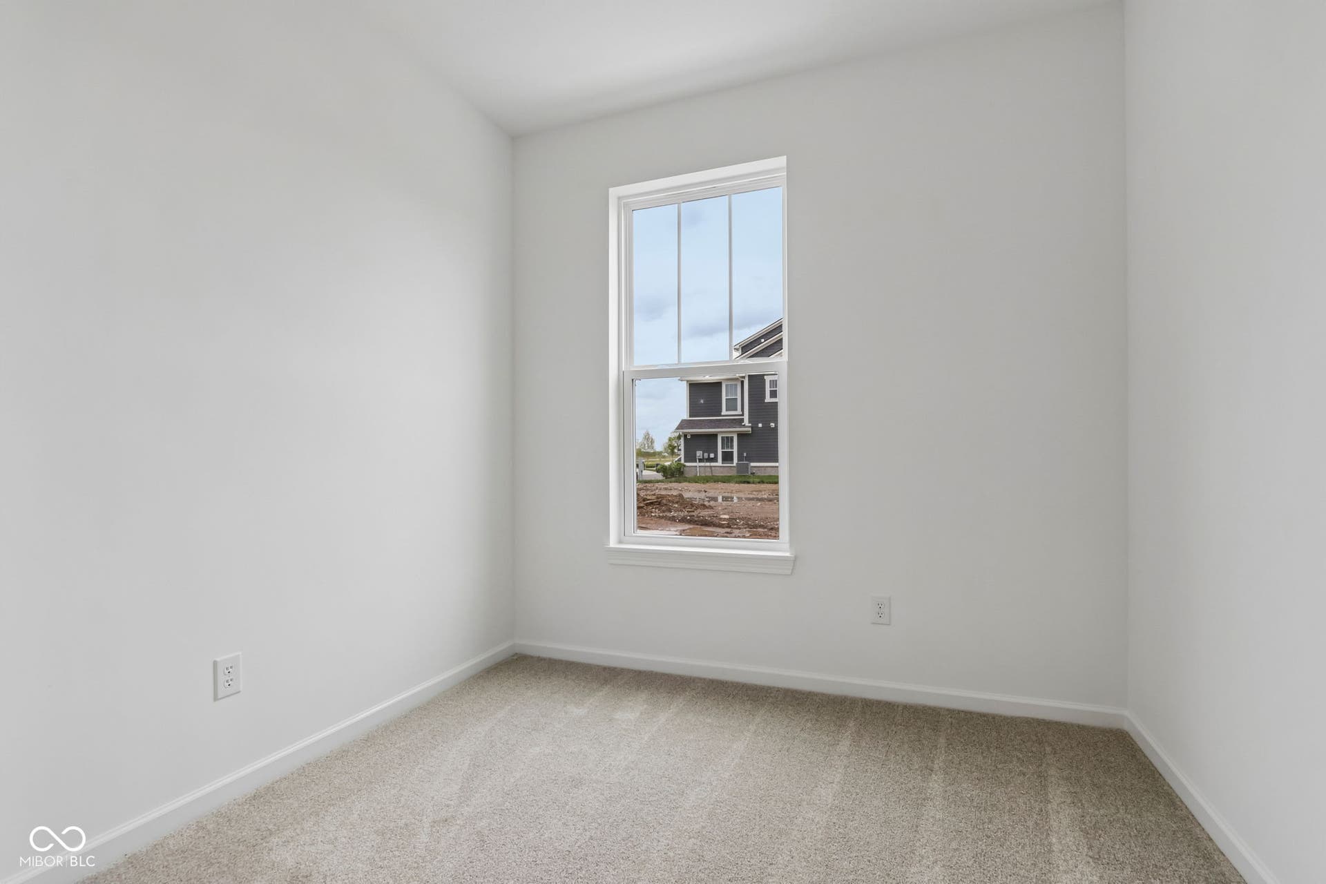 5748 Arcade Boulevard, McCordsville, IN 46055 Neutral-toned room featuring a single window with white trim, light gray carpet, and white walls