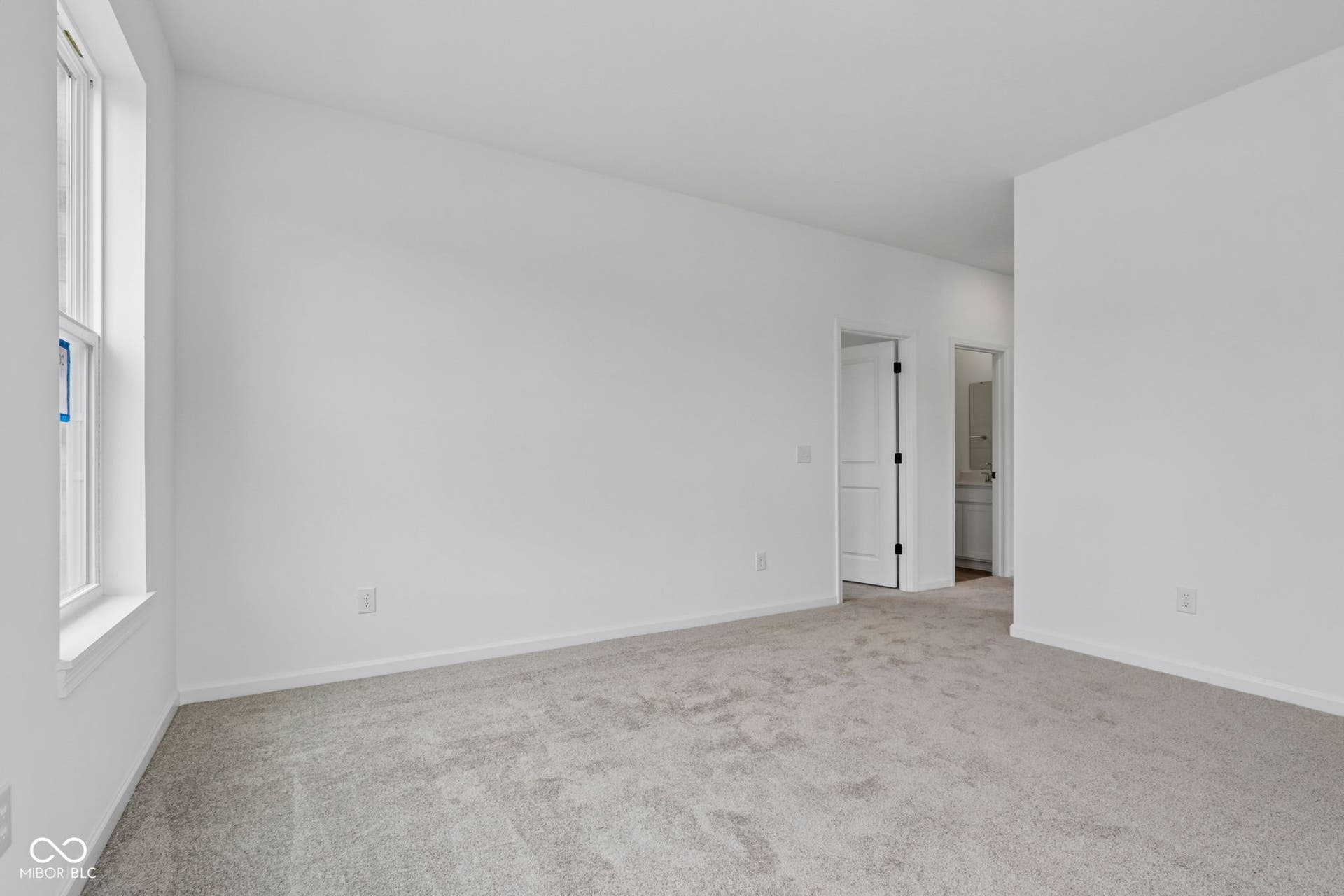 5748 Arcade Boulevard, McCordsville, IN 46055 Spacious room with light gray carpeting, crisp white walls, and a large window