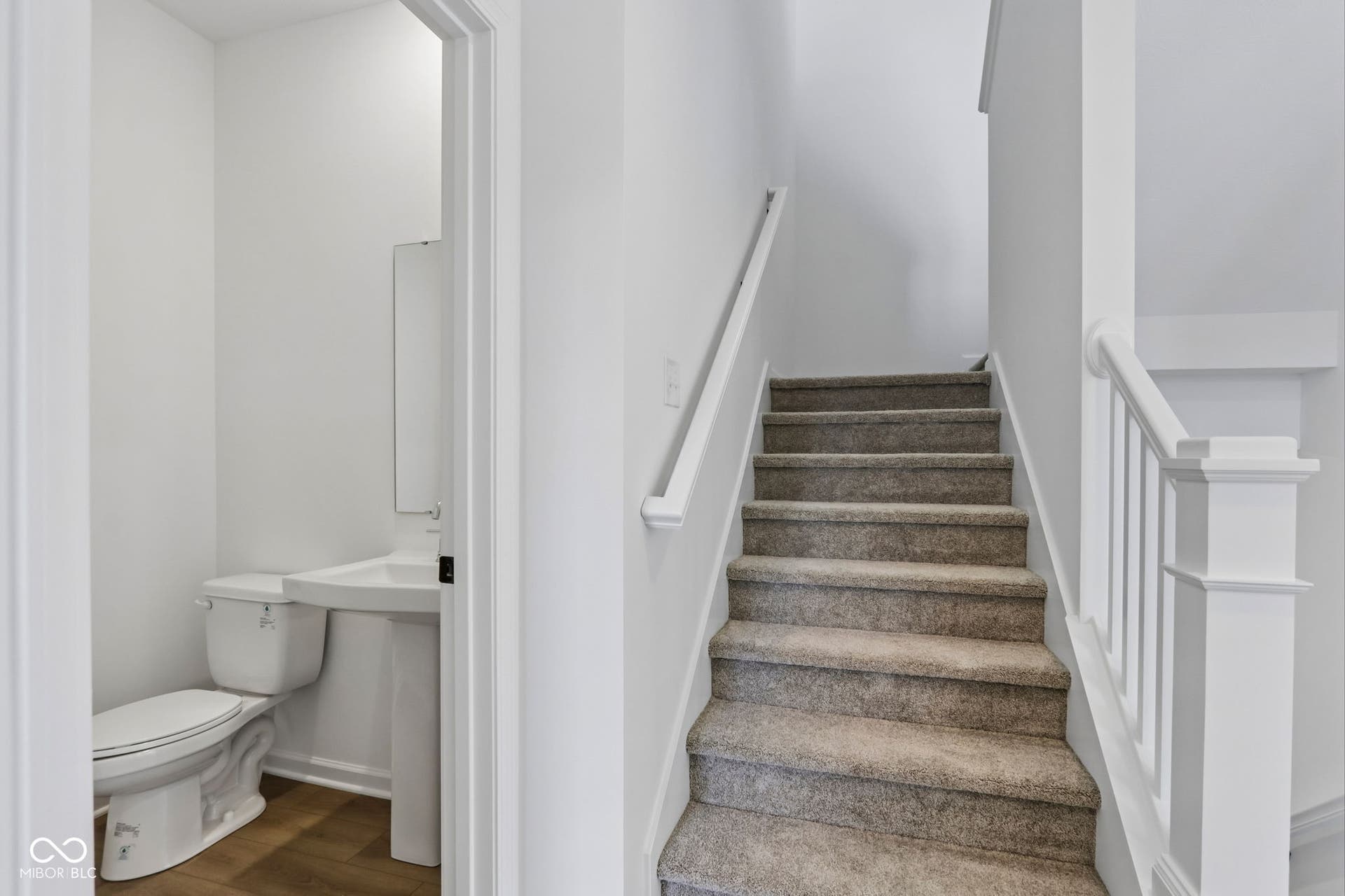 5748 Arcade Boulevard, McCordsville, IN 46055 Carpeted staircase with white balusters and handrail