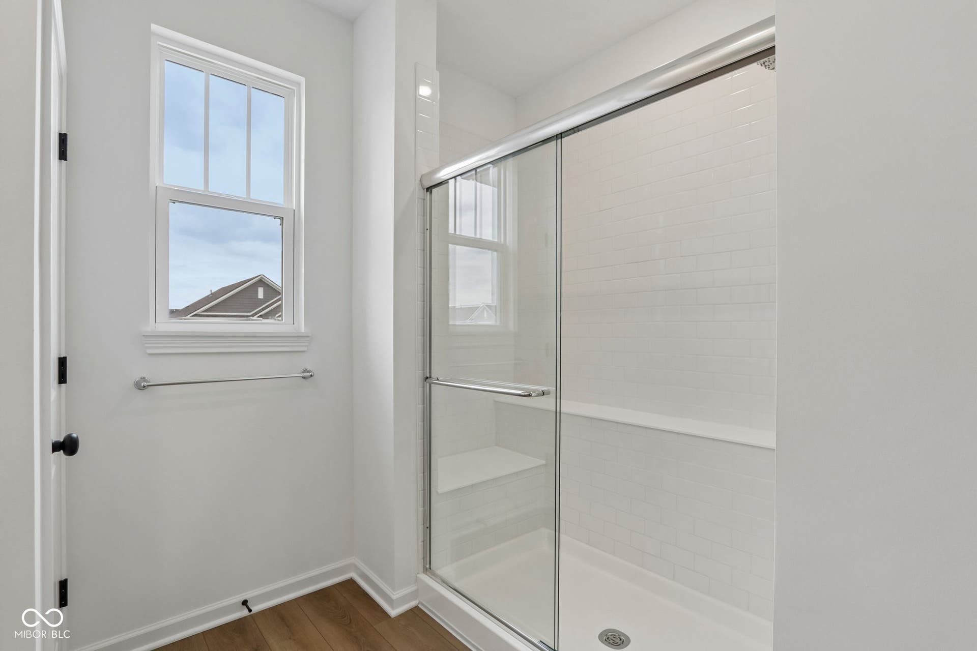 5748 Arcade Boulevard, McCordsville, IN 46055 Walk-in shower with clear glass enclosure and white subway tile surround