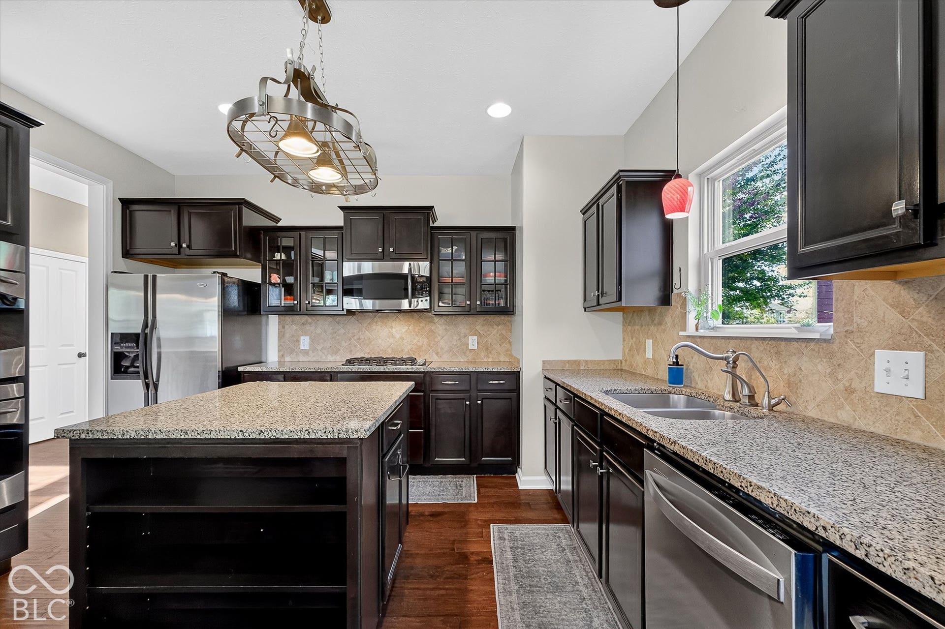 Granite countertops, stainless steel appliances, tons of prep space and storage