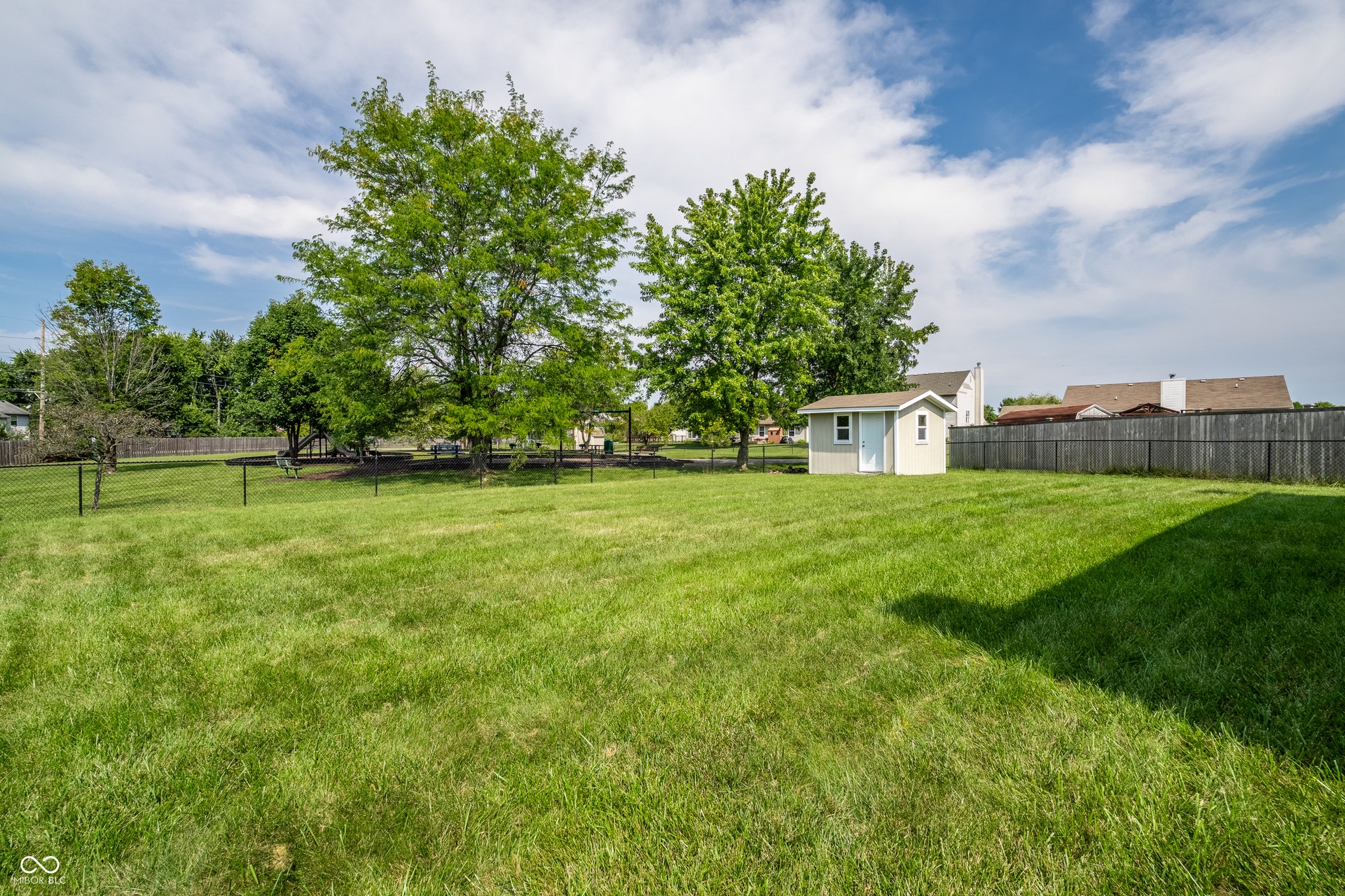 Fully fenced rear yard with plenty of space for pets, children or just enjoying the view of the private park