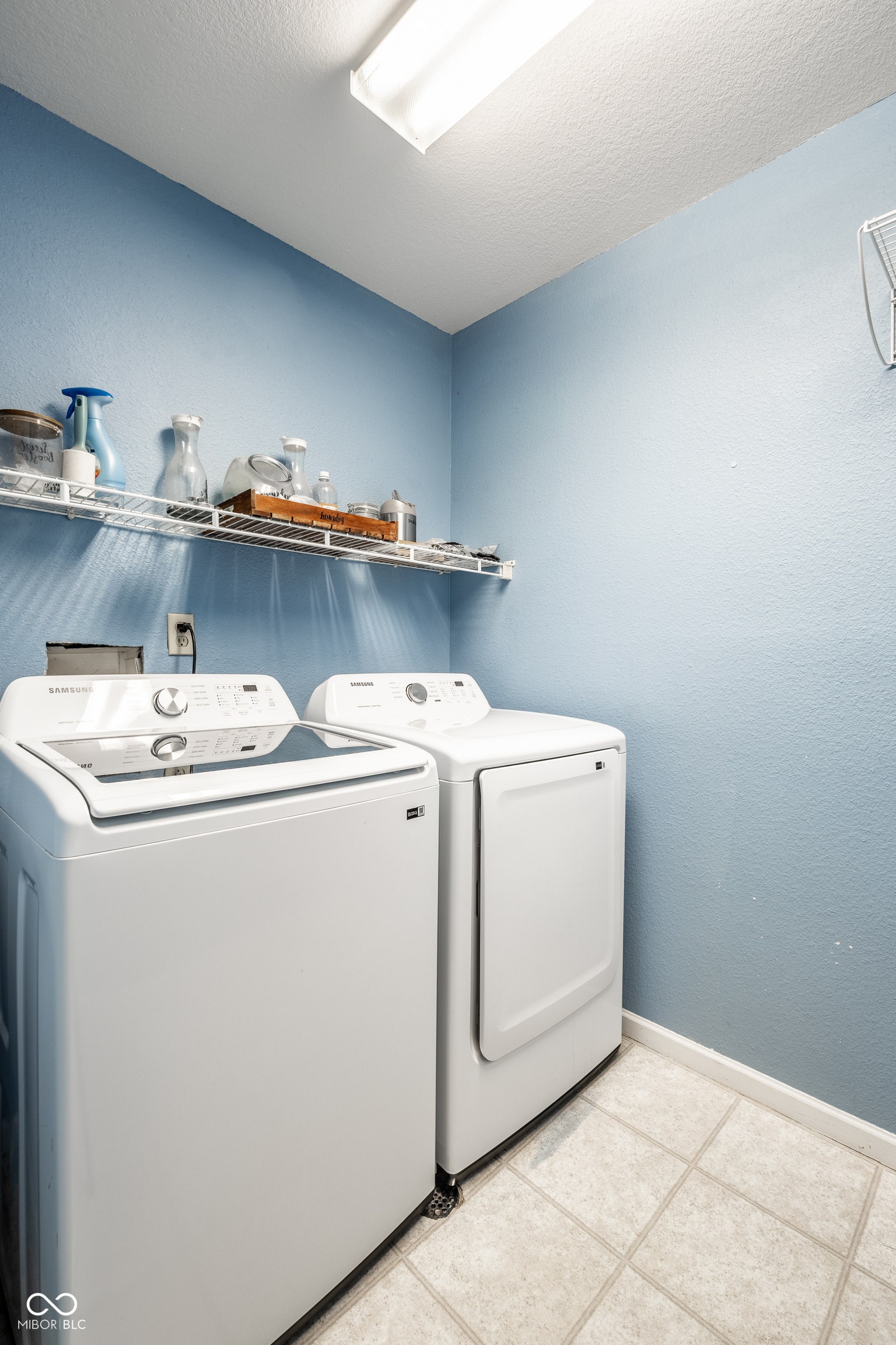 Convenient upper level laundry room.