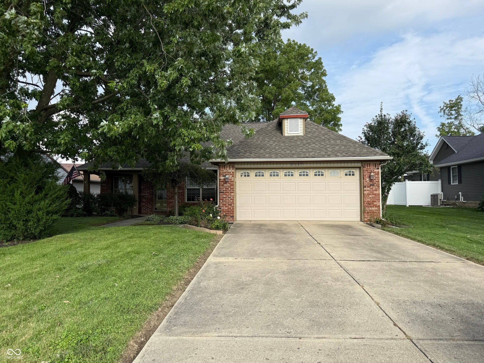 2117 Witt Road, Lebanon, IN 46052 Brick exterior with an attached two-car garage