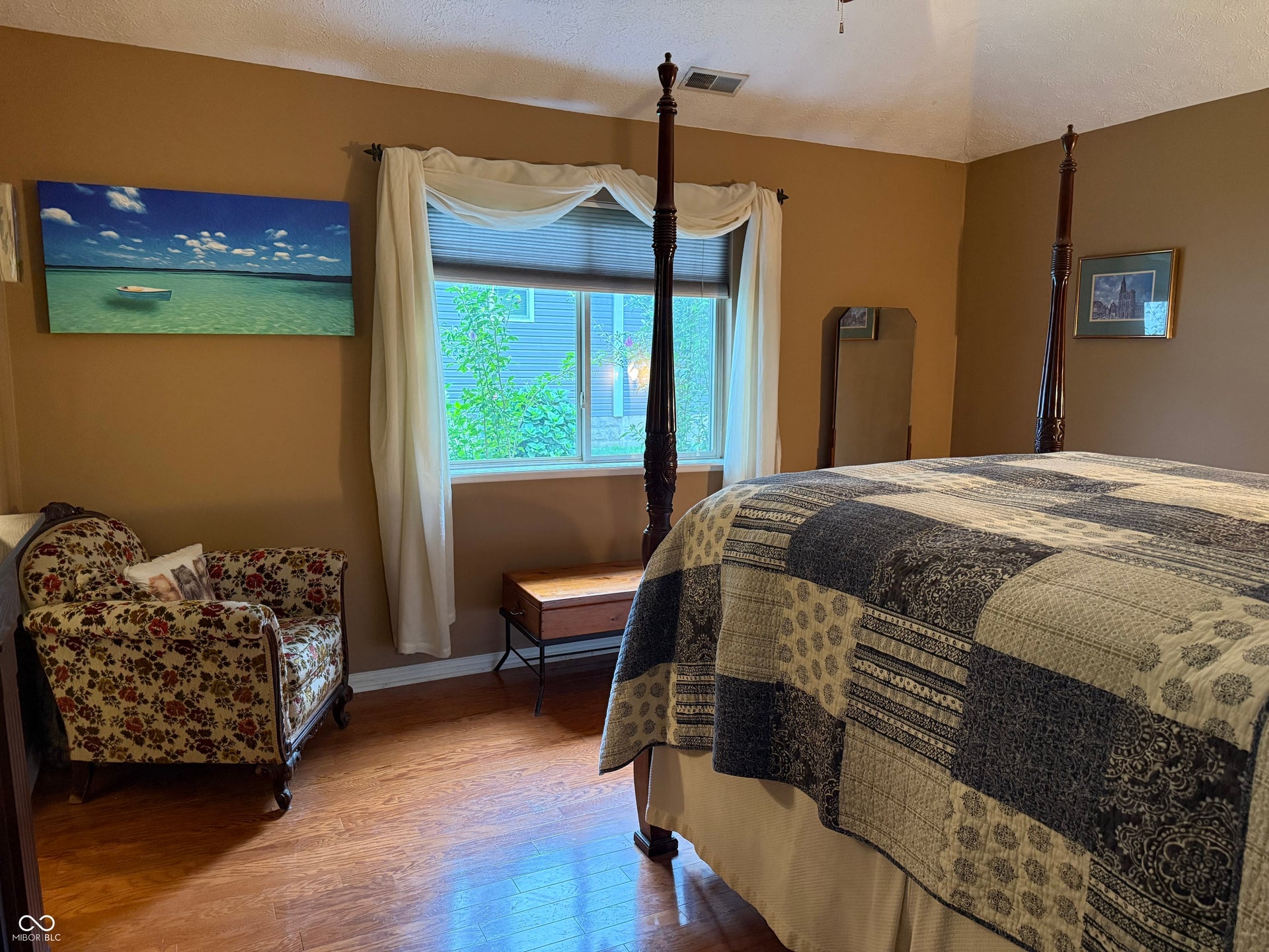 2117 Witt Road, Lebanon, IN 46052 Vaulted ceiling with a ceiling fan, wood-finish flooring, and a large window with privacy blinds