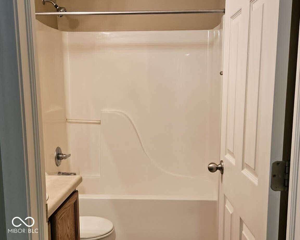 2nd full bath bathroom featuring a white integrated tub and shower unit, chrome showerhead, and chrome faucet