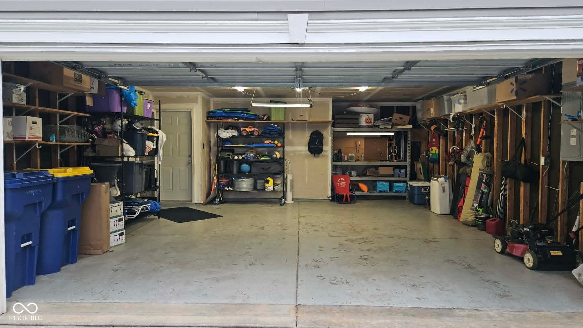 Garage has plenty of room for storage and two cars!