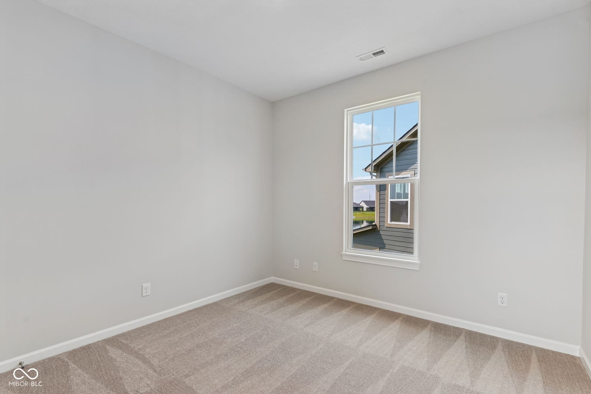 15762 Showdown Road, Noblesville, IN 46060 Carpeted room featuring a double-hung window, light gray walls, and white baseboards