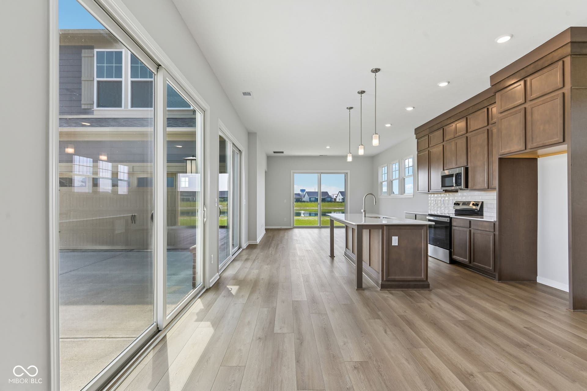 15762 Showdown Road, Noblesville, IN 46060 Open-concept living space with wood-finish flooring throughout