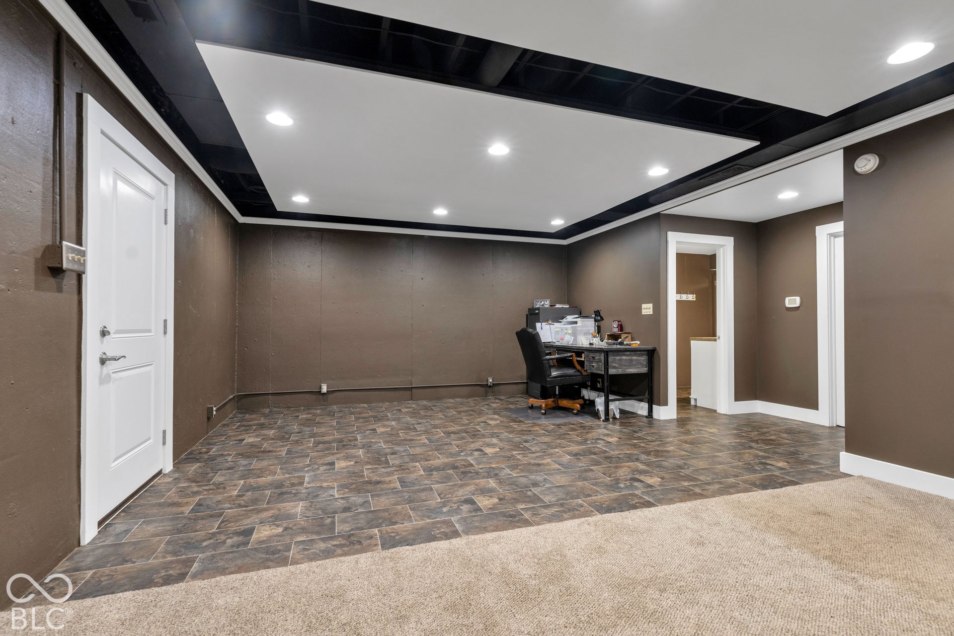 Recessed lighting in a dropped ceiling with black accent trim