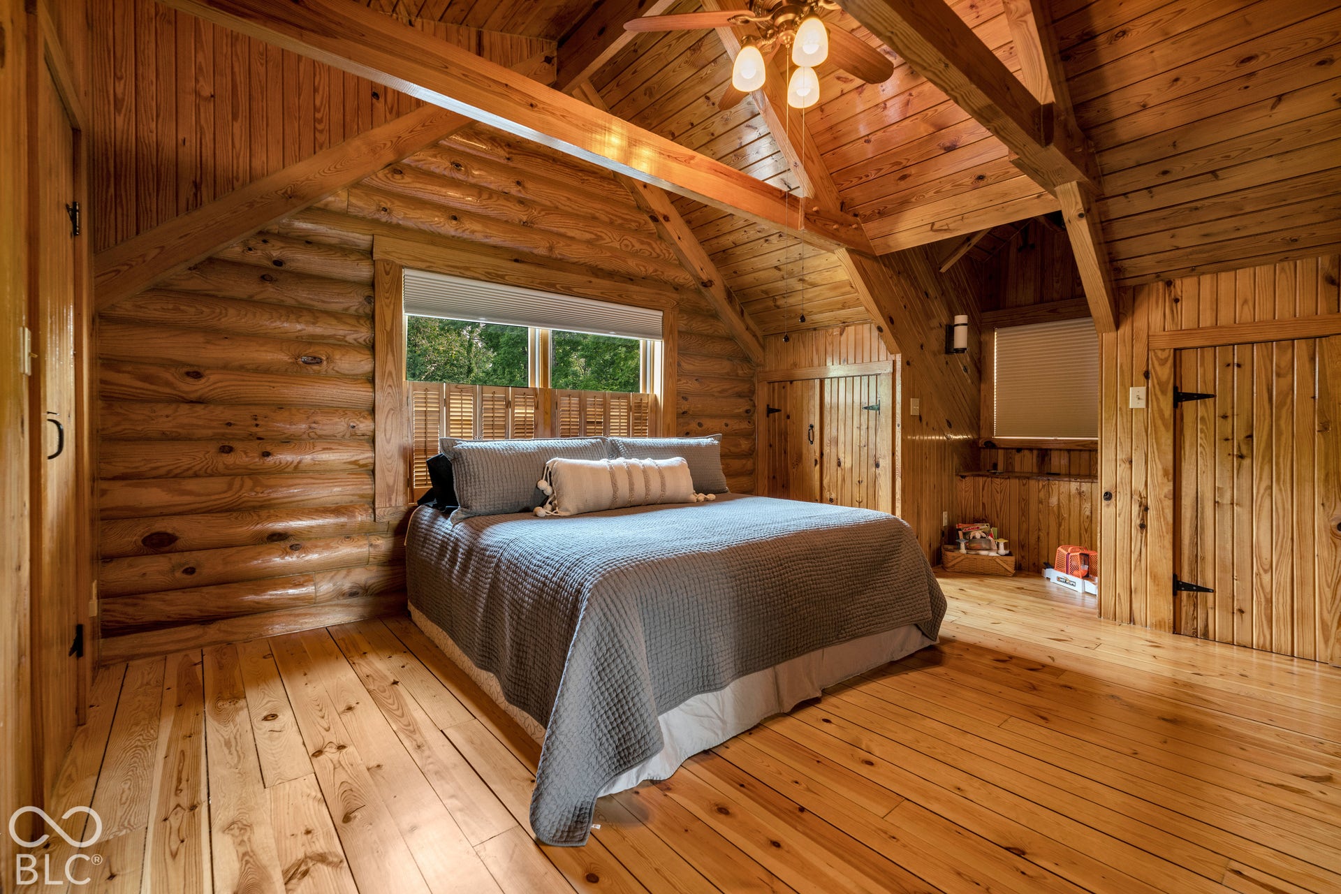 Wood-paneled walls and ceiling with exposed beams