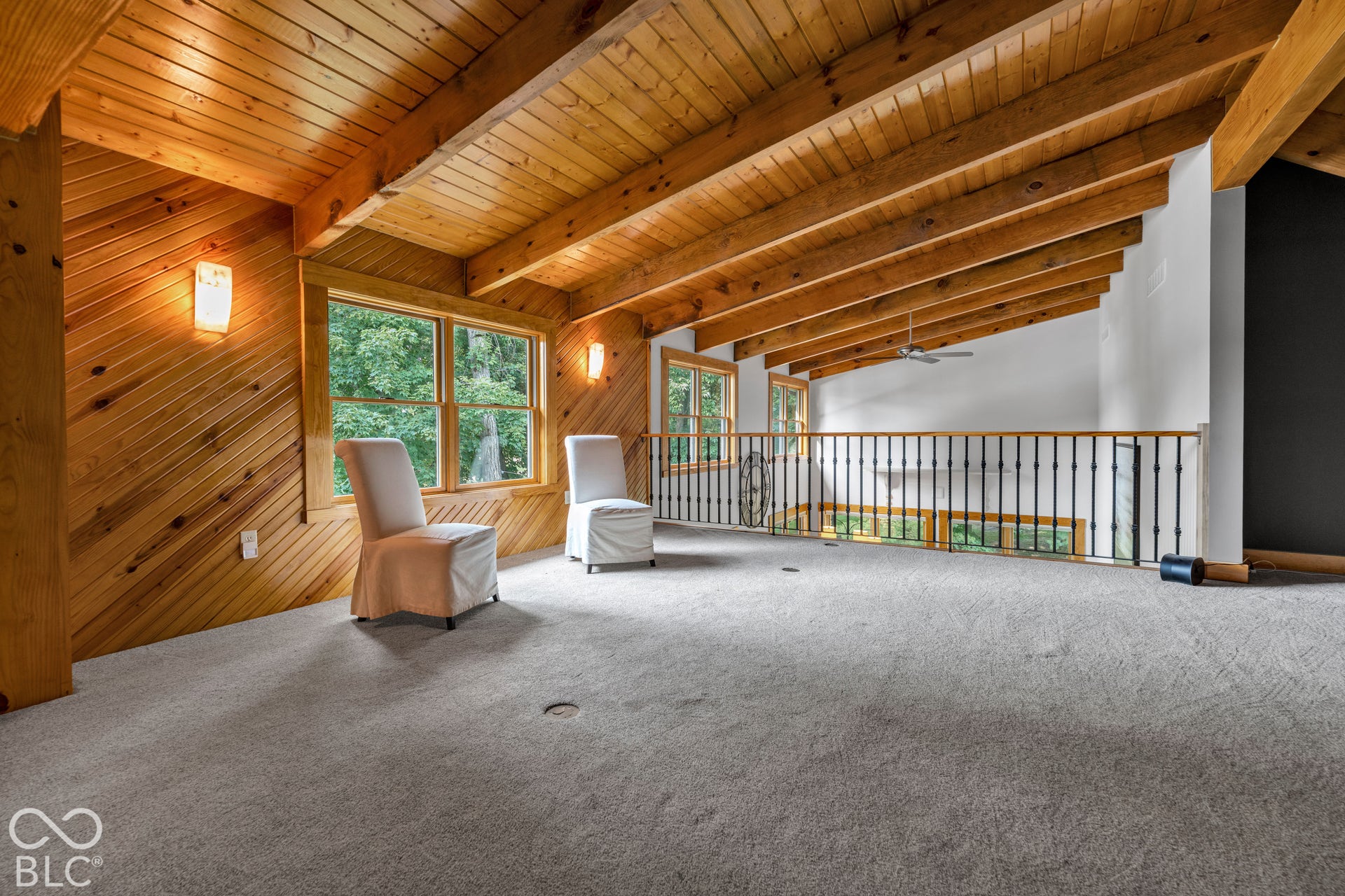 Vaulted wood-paneled ceiling with exposed beams
