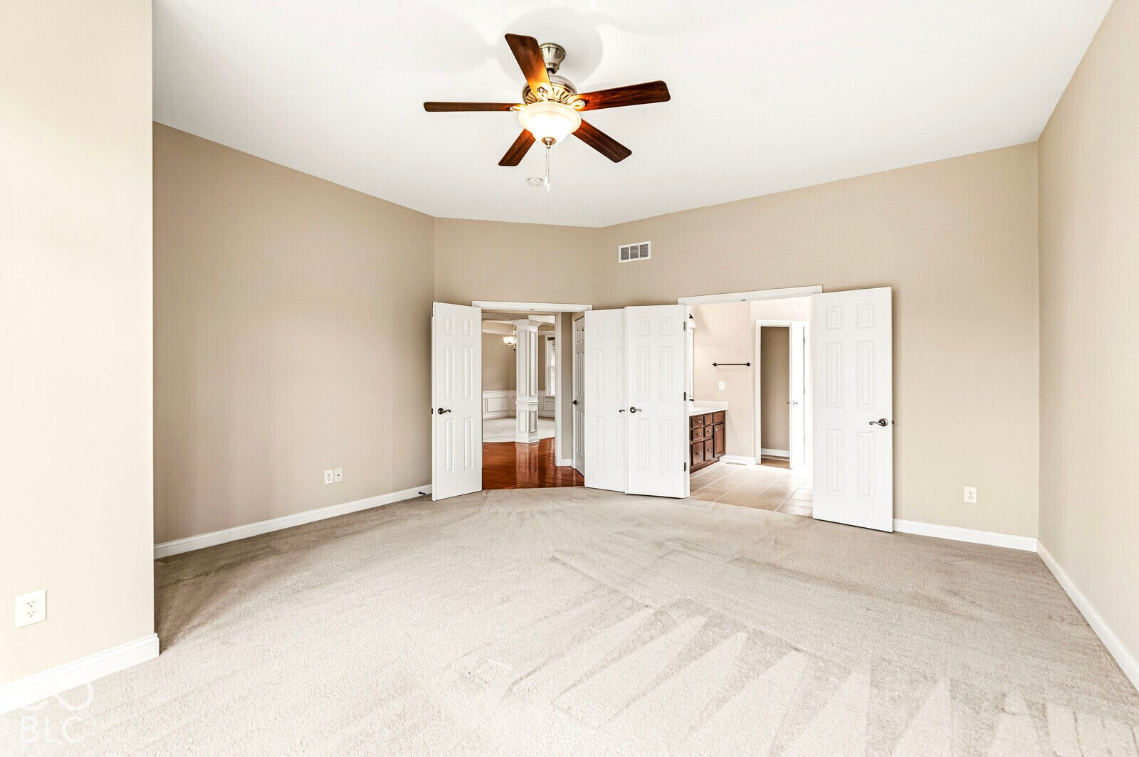 Primary bedroom with 10 foot ceilings on main level