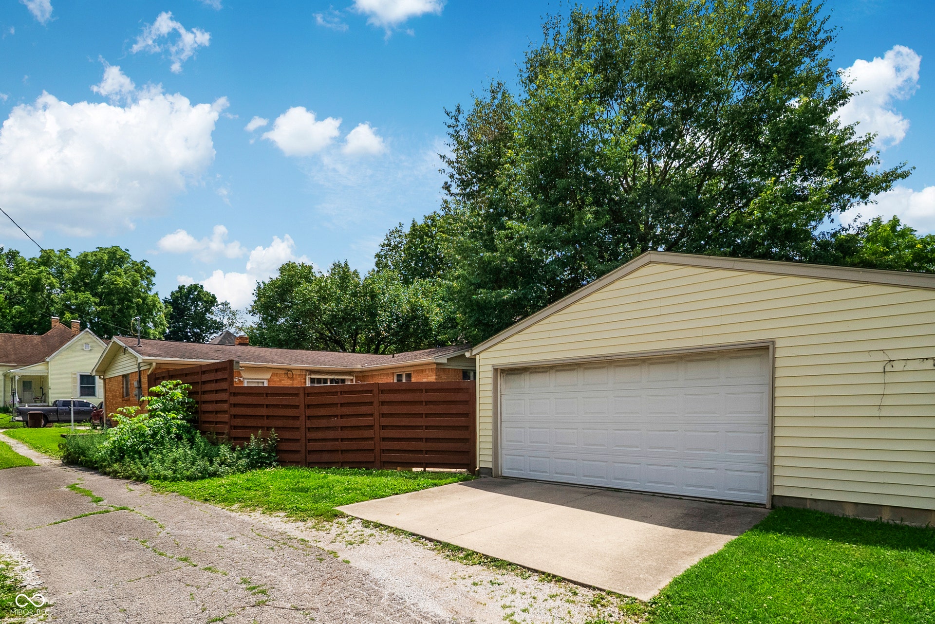 720 sq ft, 2 car detached garage in rear of home provides an abundance of extra parking & endless possibilities.