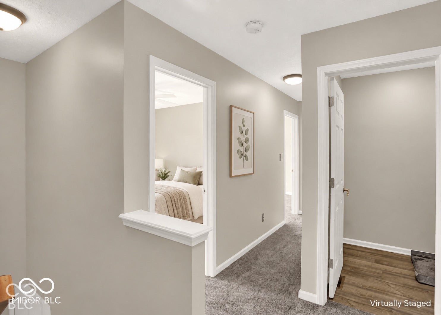 Neutral wall paint throughout, flush-mount ceiling lights, and wood-finish flooring