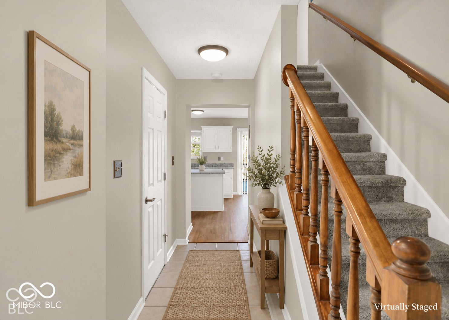 Hardwood staircase railing with carpeted treads