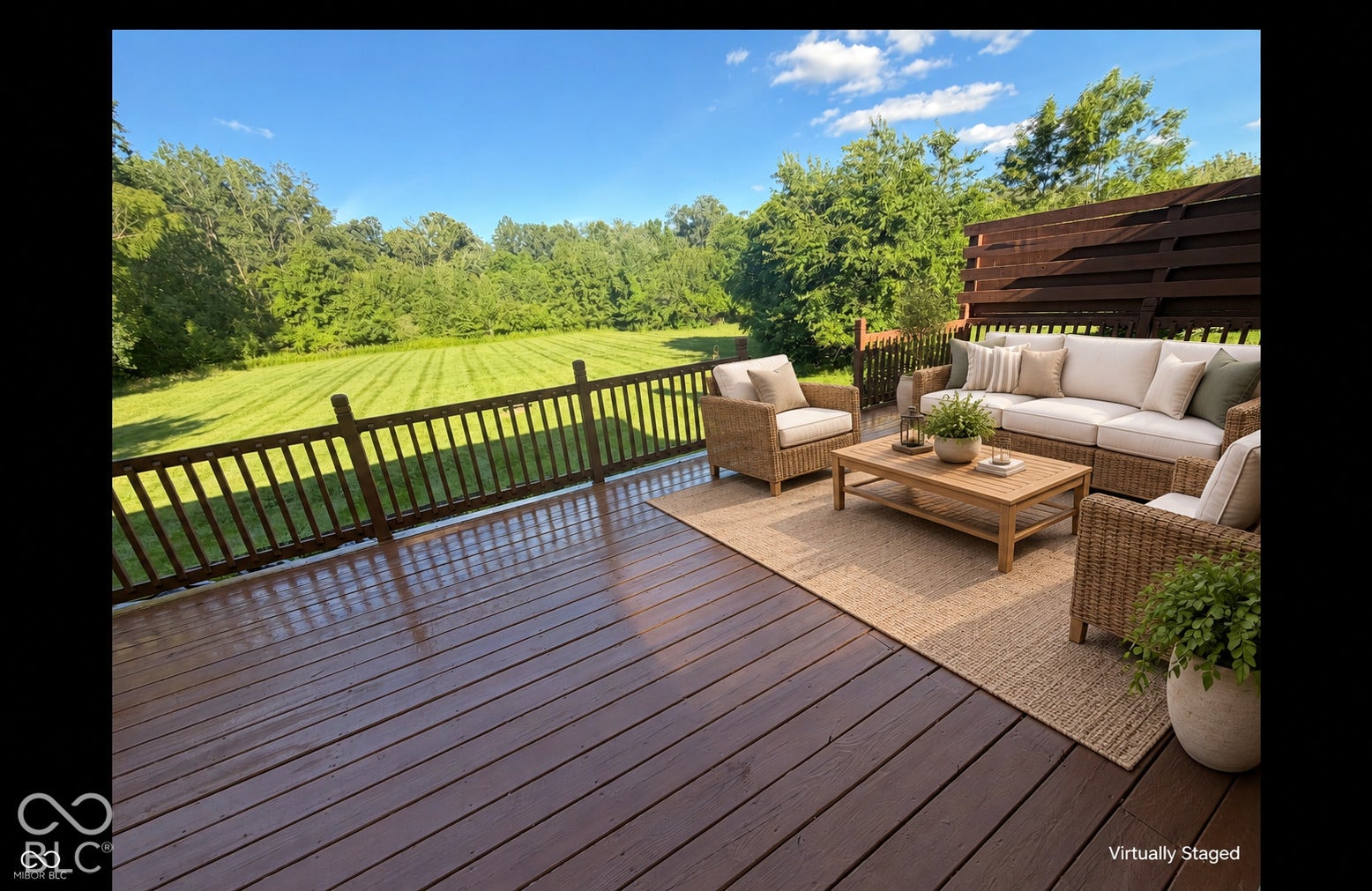 Expansive outdoor deck with wood-finish flooring and protective railing