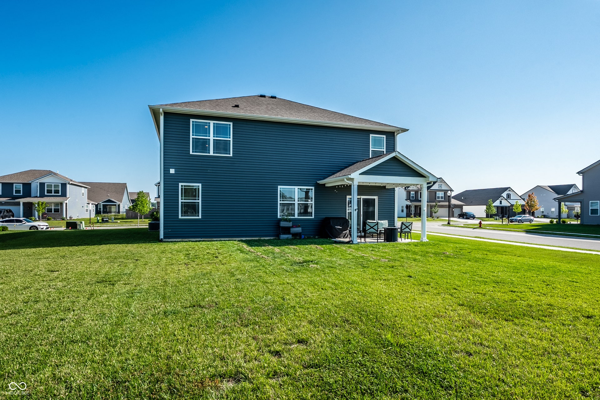 Covered back porch overlooking pond.  Large corner lot.