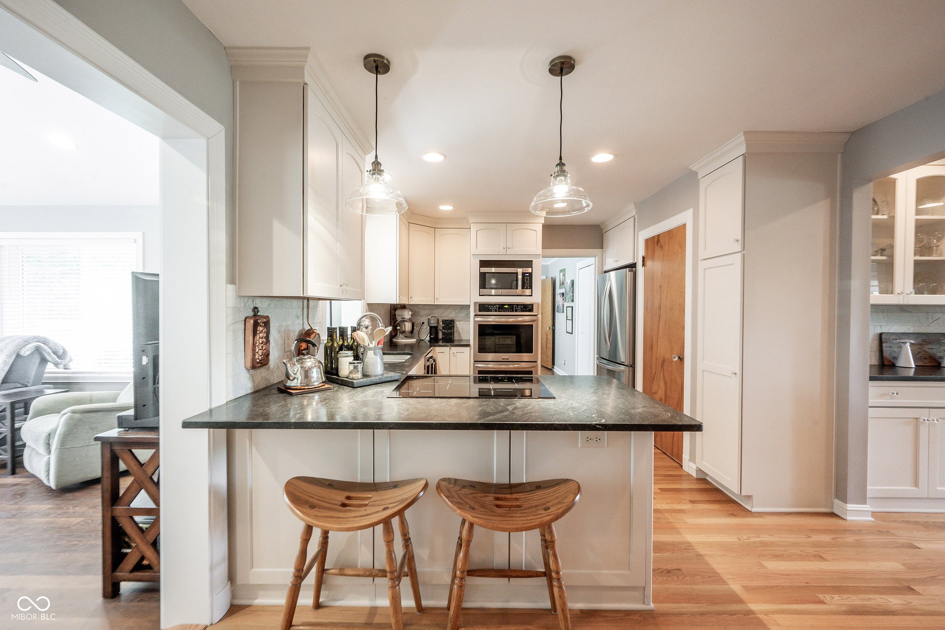 View from Breakfast Bar with Pendant Lighting - convenienly located as the hub of the home, connecting to the Family Room, Dining Room and Bedroom 3