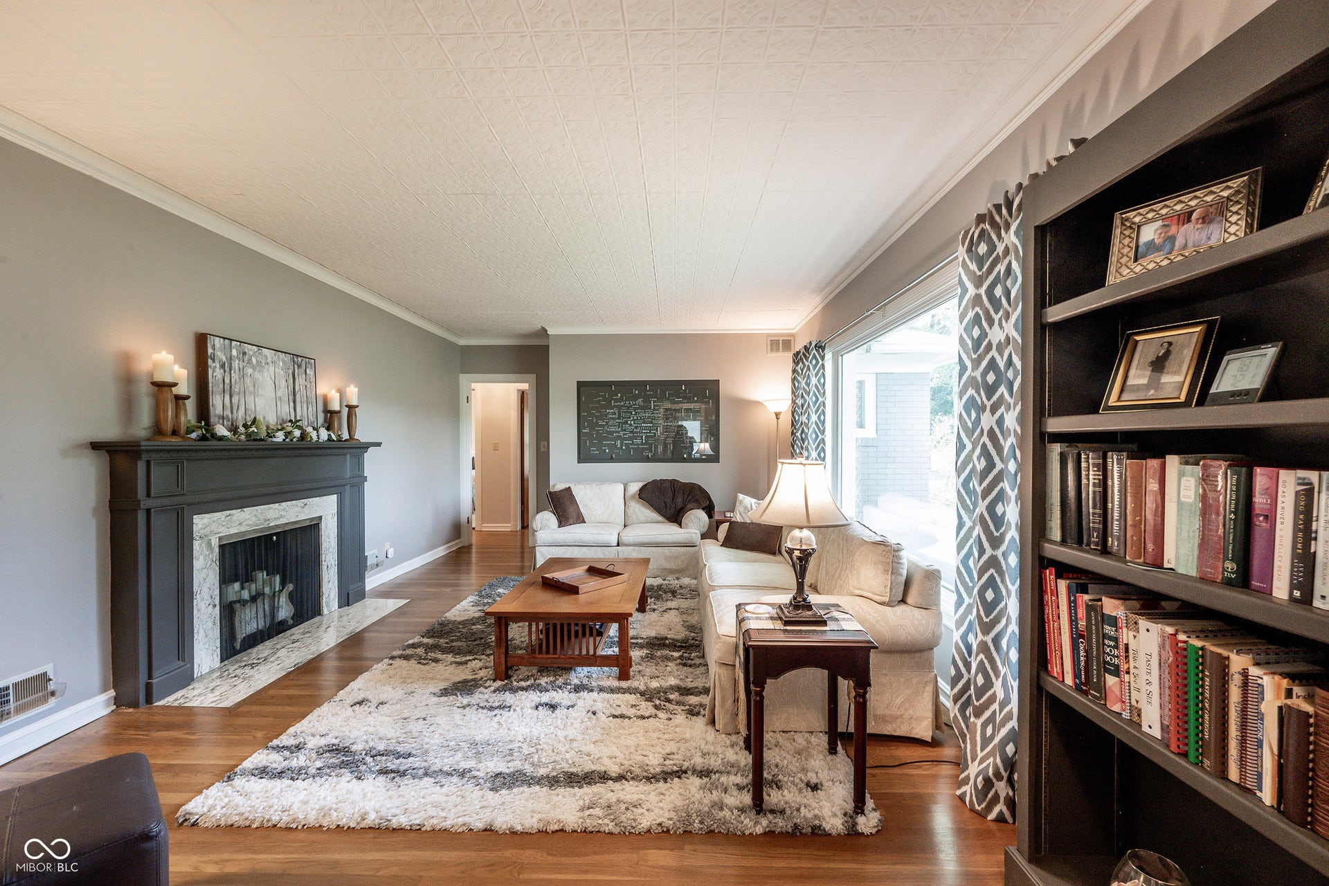 Large Living Room beautiful view of deep front yard; Crown Molding. 3/4" Hardwood Flooring.