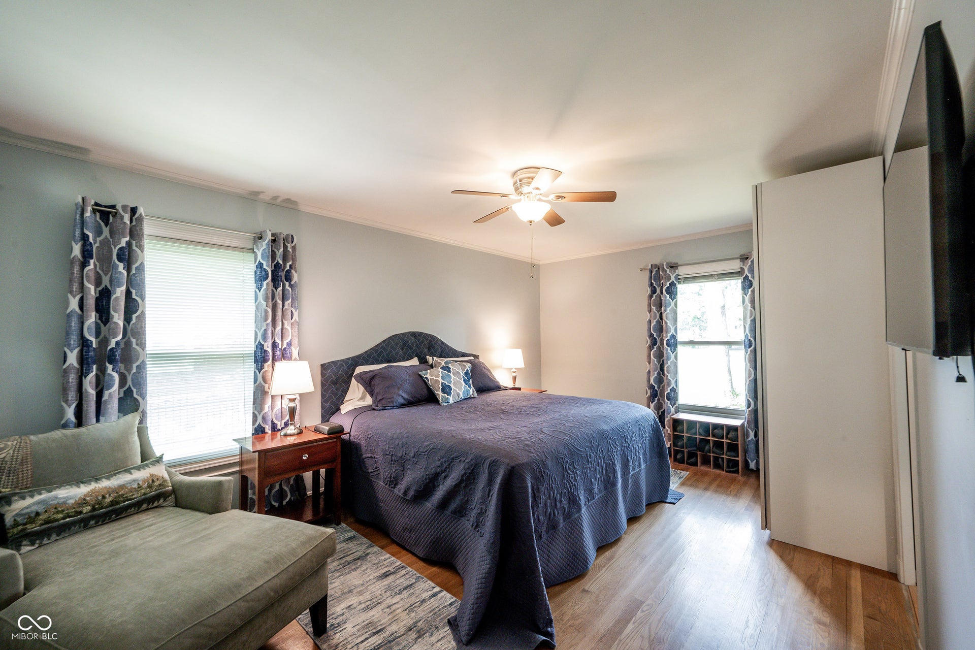 Spacious Primary Bedroom with 3/4" Hardwood Flooring, Crown Molding, Ceiling Fan/Light and Built In Closet space PLUS a walk in closet in the Primary Bath.